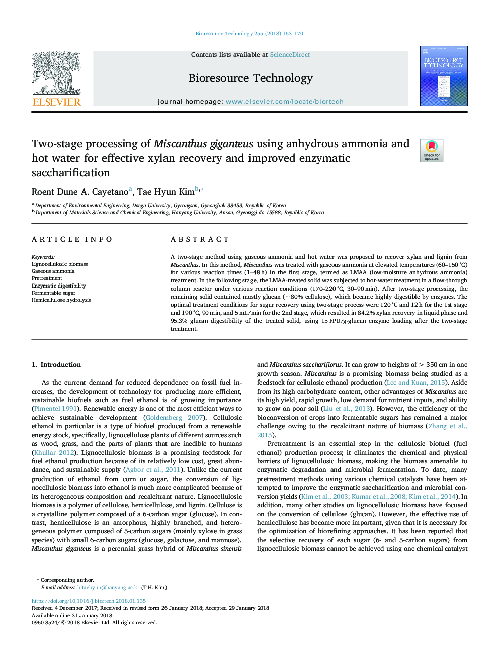 Two-stage processing of Miscanthus giganteus using anhydrous ammonia and hot water for effective xylan recovery and improved enzymatic saccharification