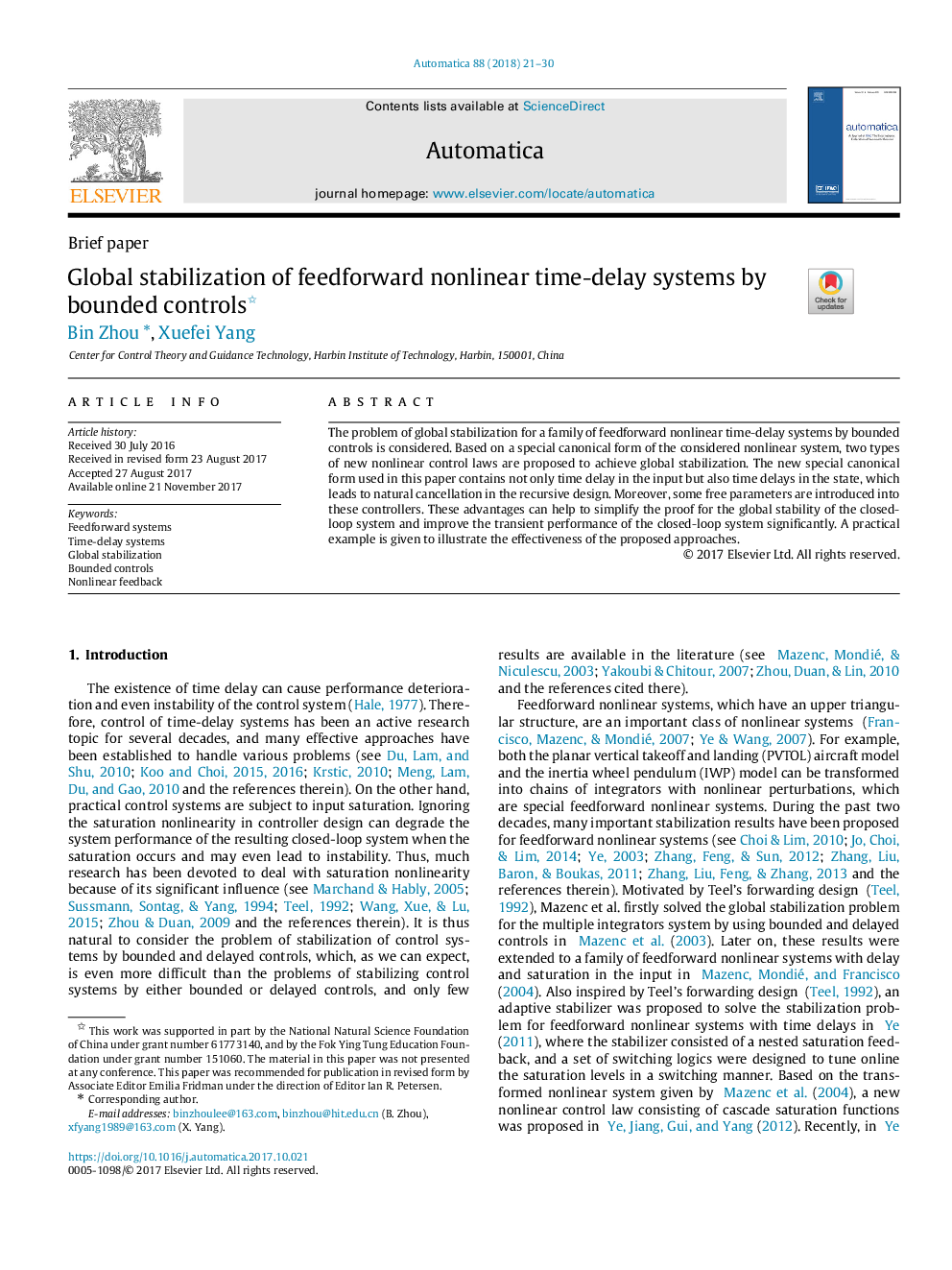 Global stabilization of feedforward nonlinear time-delay systems by bounded controls