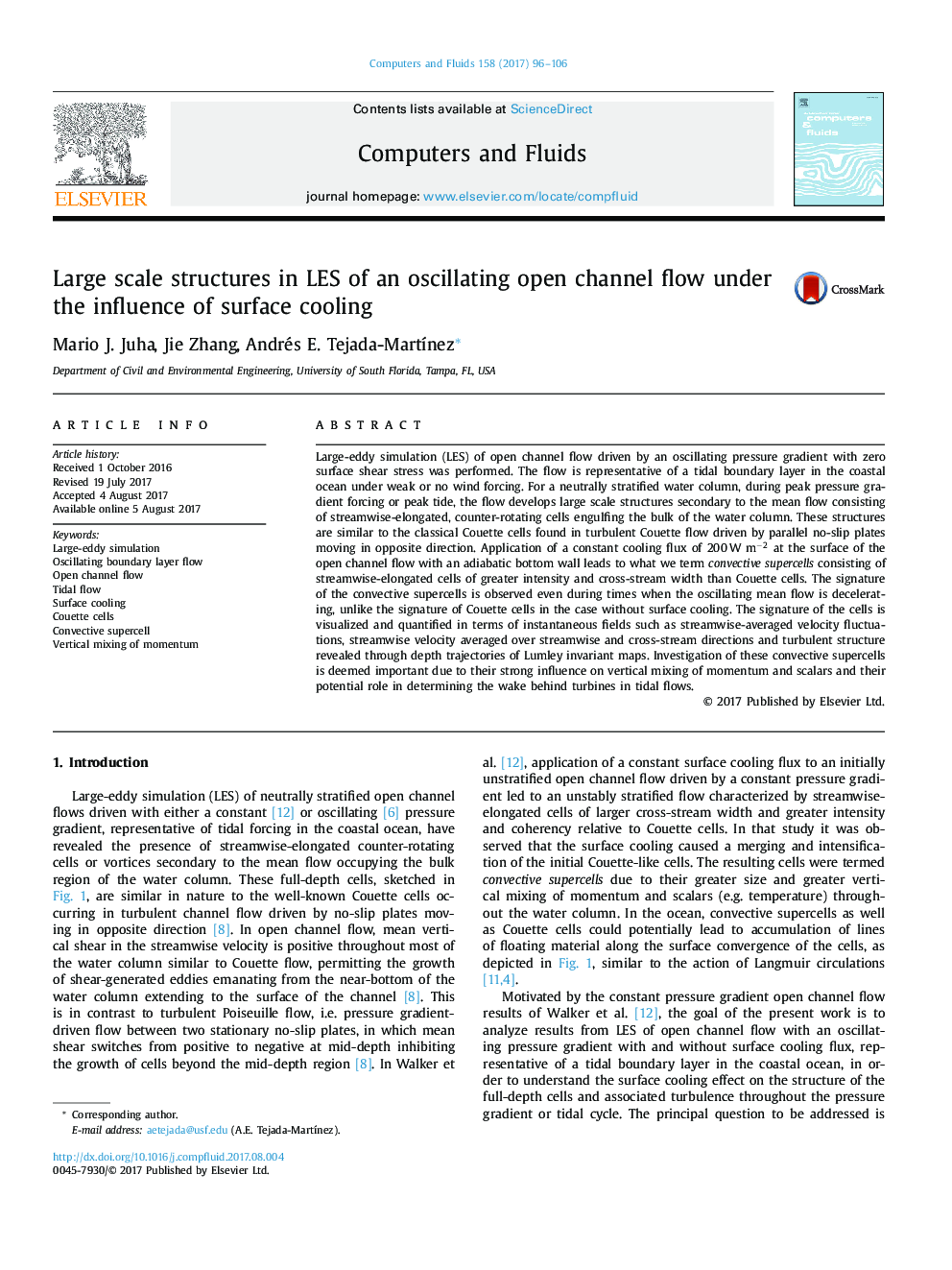 Large scale structures in LES of an oscillating open channel flow under the influence of surface cooling