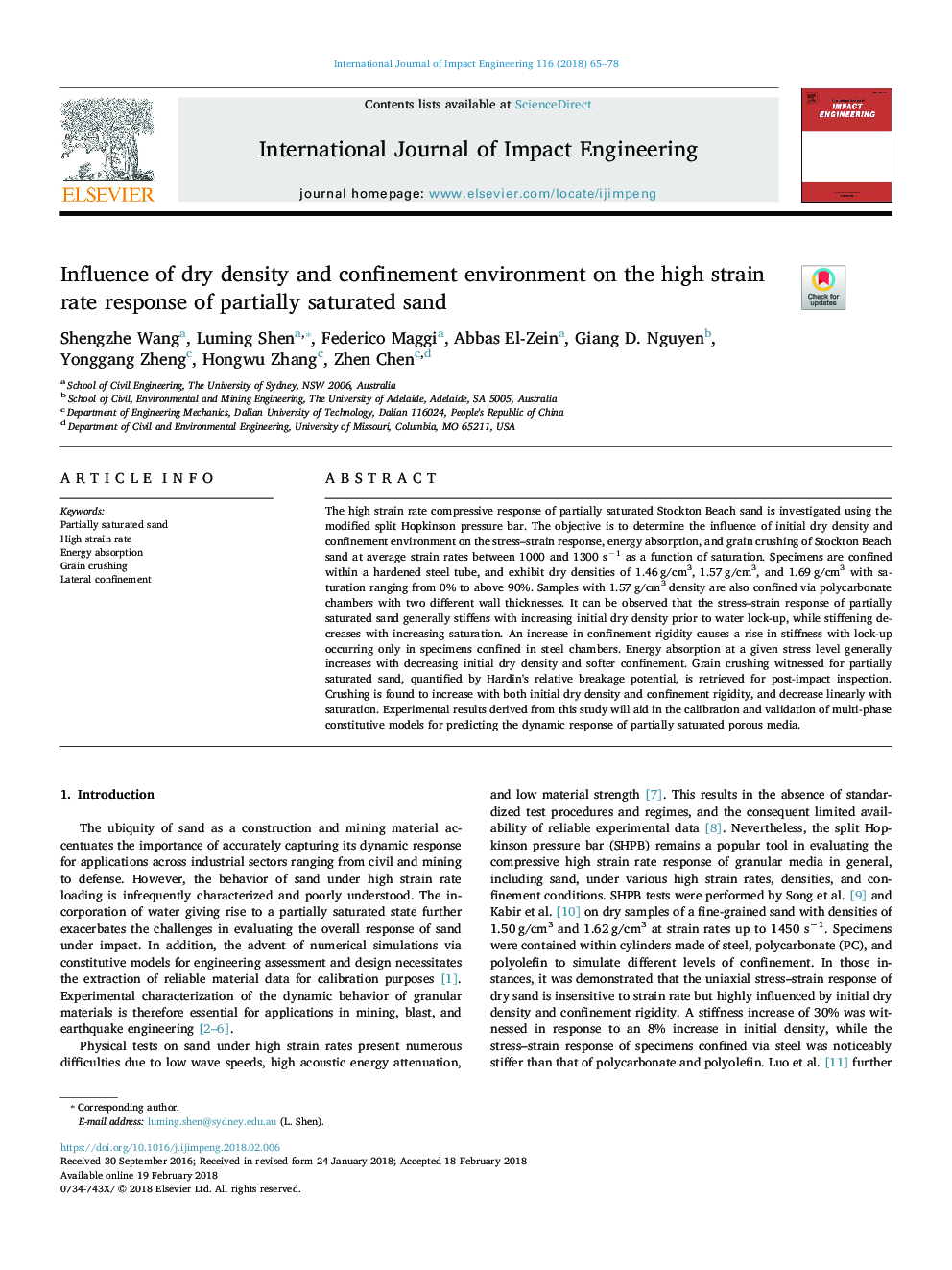 Influence of dry density and confinement environment on the high strain rate response of partially saturated sand