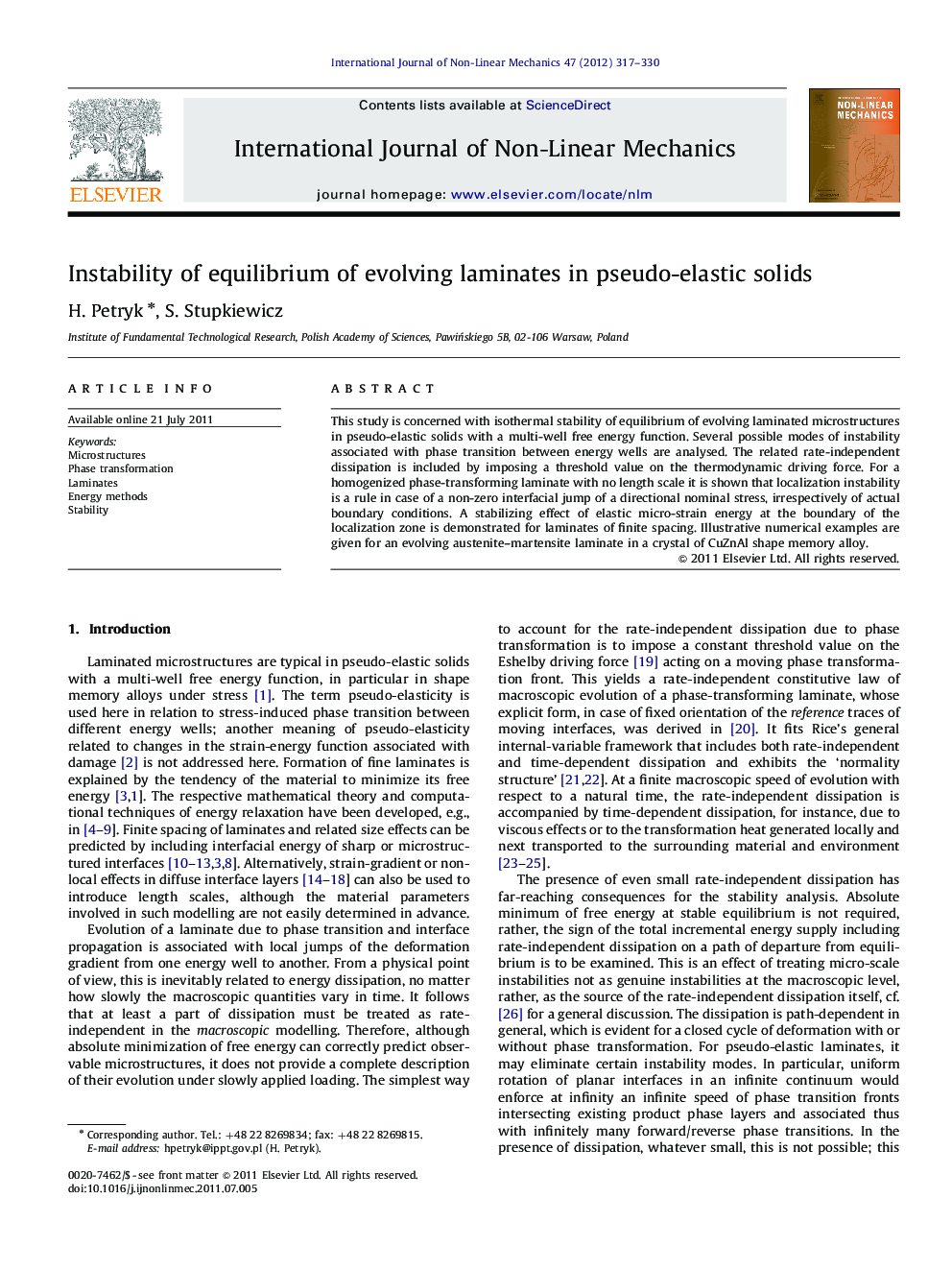 Instability of equilibrium of evolving laminates in pseudo-elastic solids