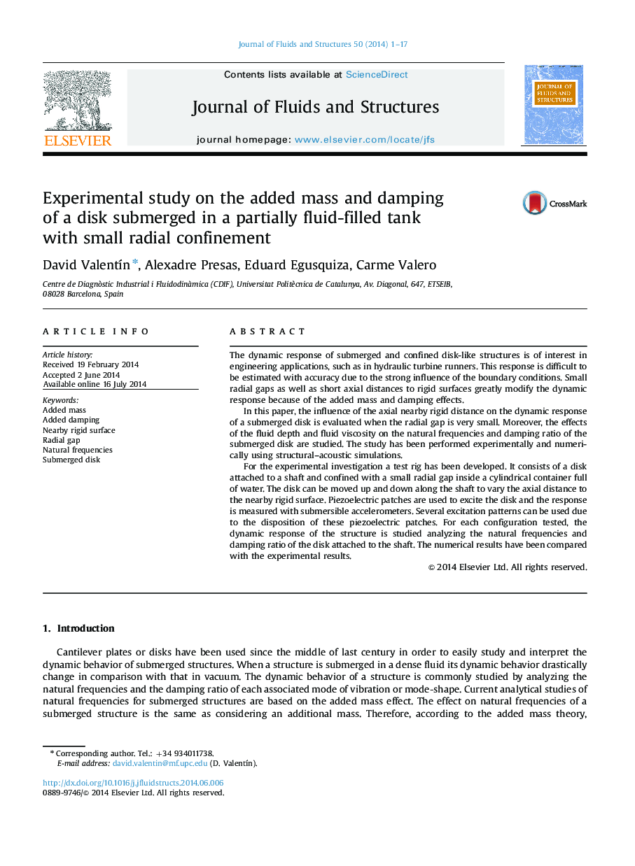 Experimental study on the added mass and damping of a disk submerged in a partially fluid-filled tank with small radial confinement