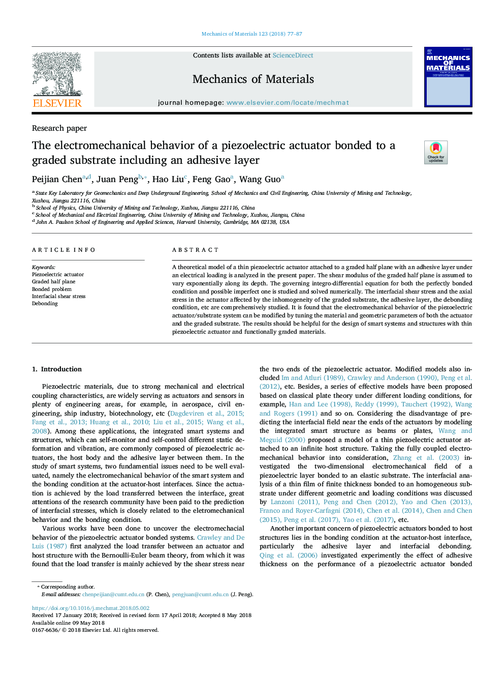 The electromechanical behavior of a piezoelectric actuator bonded to a graded substrate including an adhesive layer