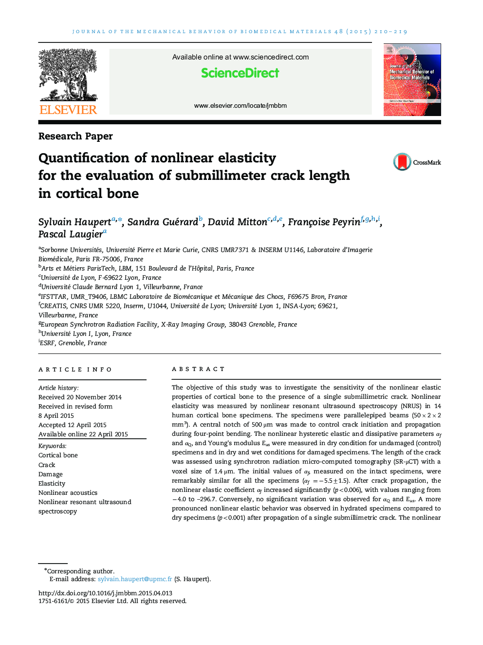 Quantification of nonlinear elasticity for the evaluation of submillimeter crack length in cortical bone