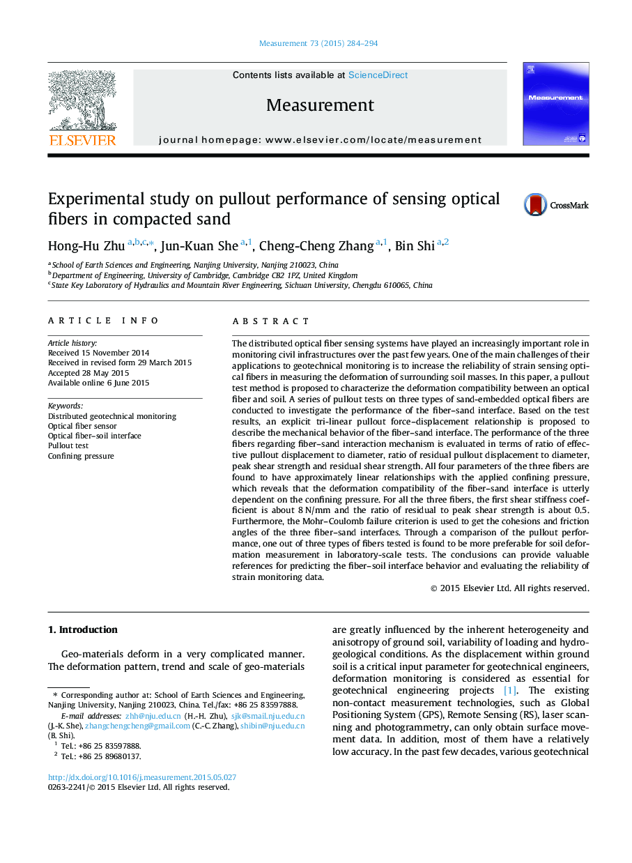 Experimental study on pullout performance of sensing optical fibers in compacted sand