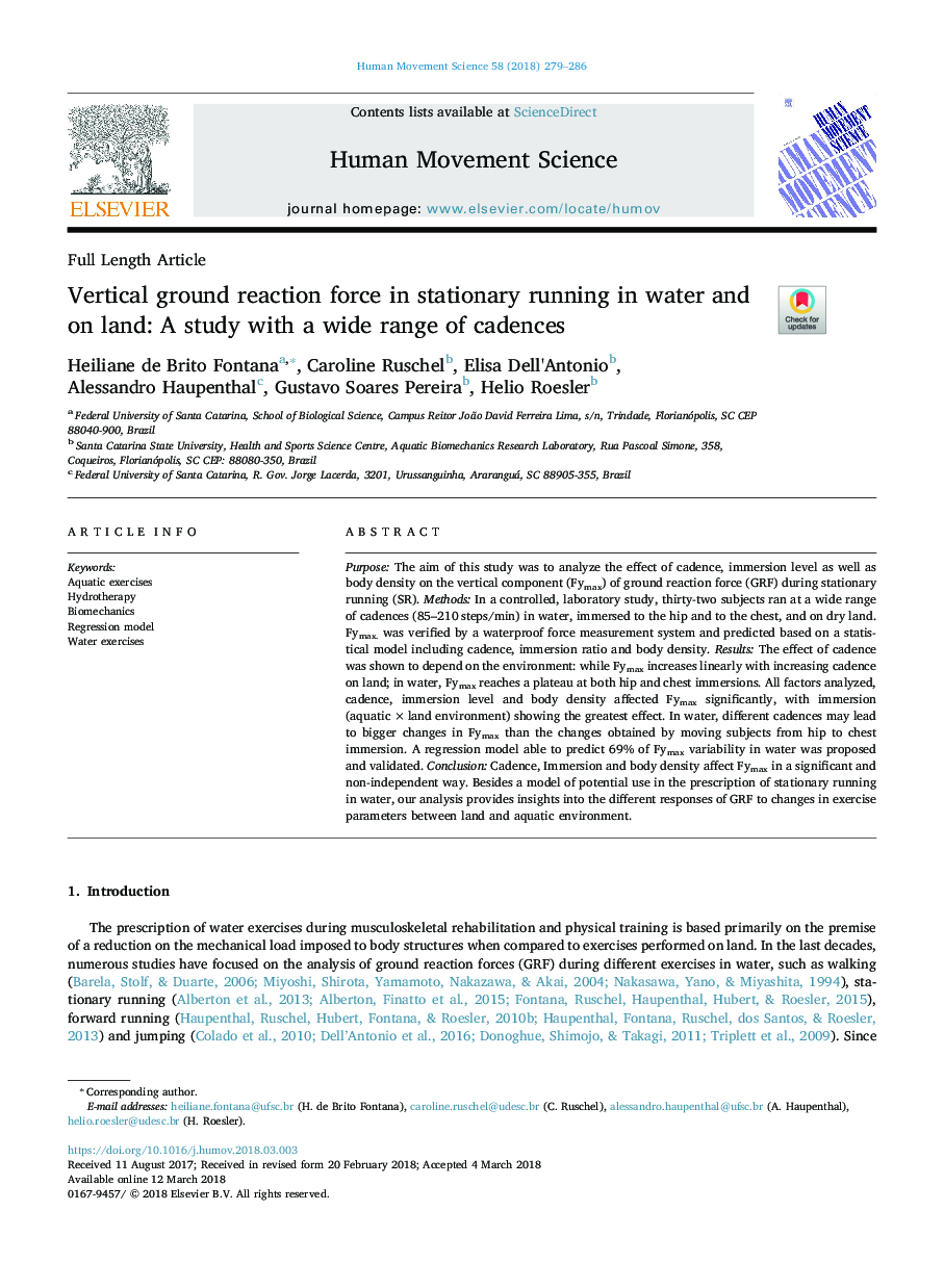 Vertical ground reaction force in stationary running in water and on land: A study with a wide range of cadences