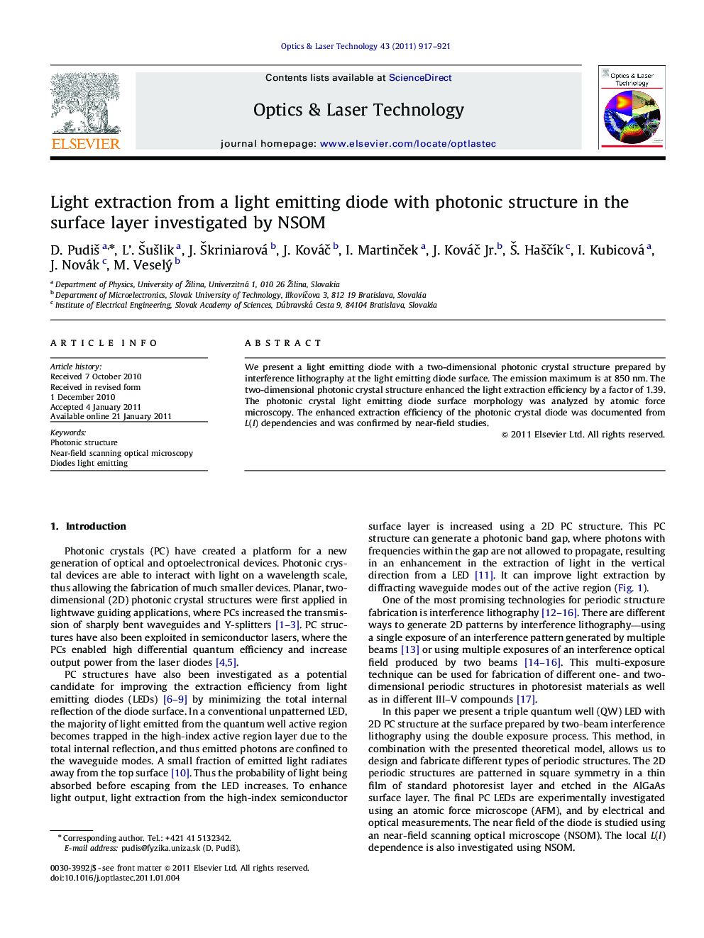 Light extraction from a light emitting diode with photonic structure in the surface layer investigated by NSOM