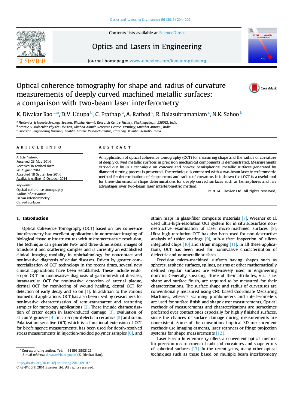 Optical coherence tomography for shape and radius of curvature measurements of deeply curved machined metallic surfaces: a comparison with two-beam laser interferometry