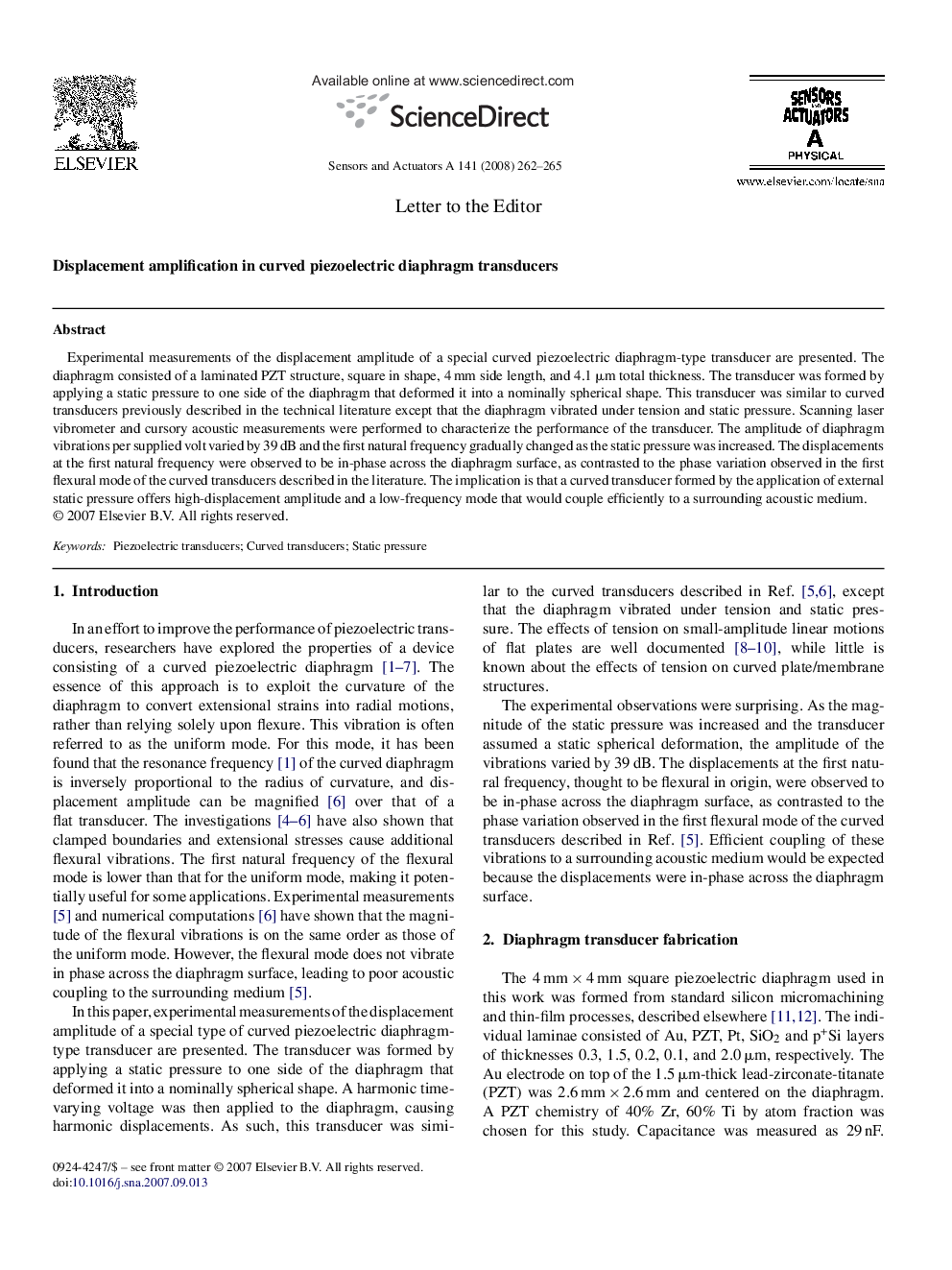 Displacement amplification in curved piezoelectric diaphragm transducers