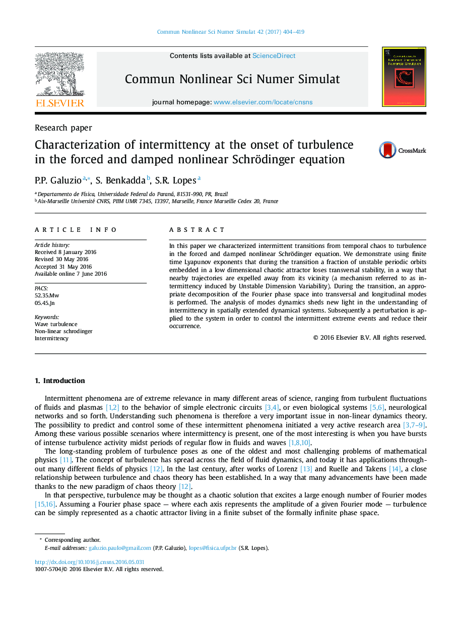 Characterization of intermittency at the onset of turbulence in the forced and damped nonlinear Schrödinger equation