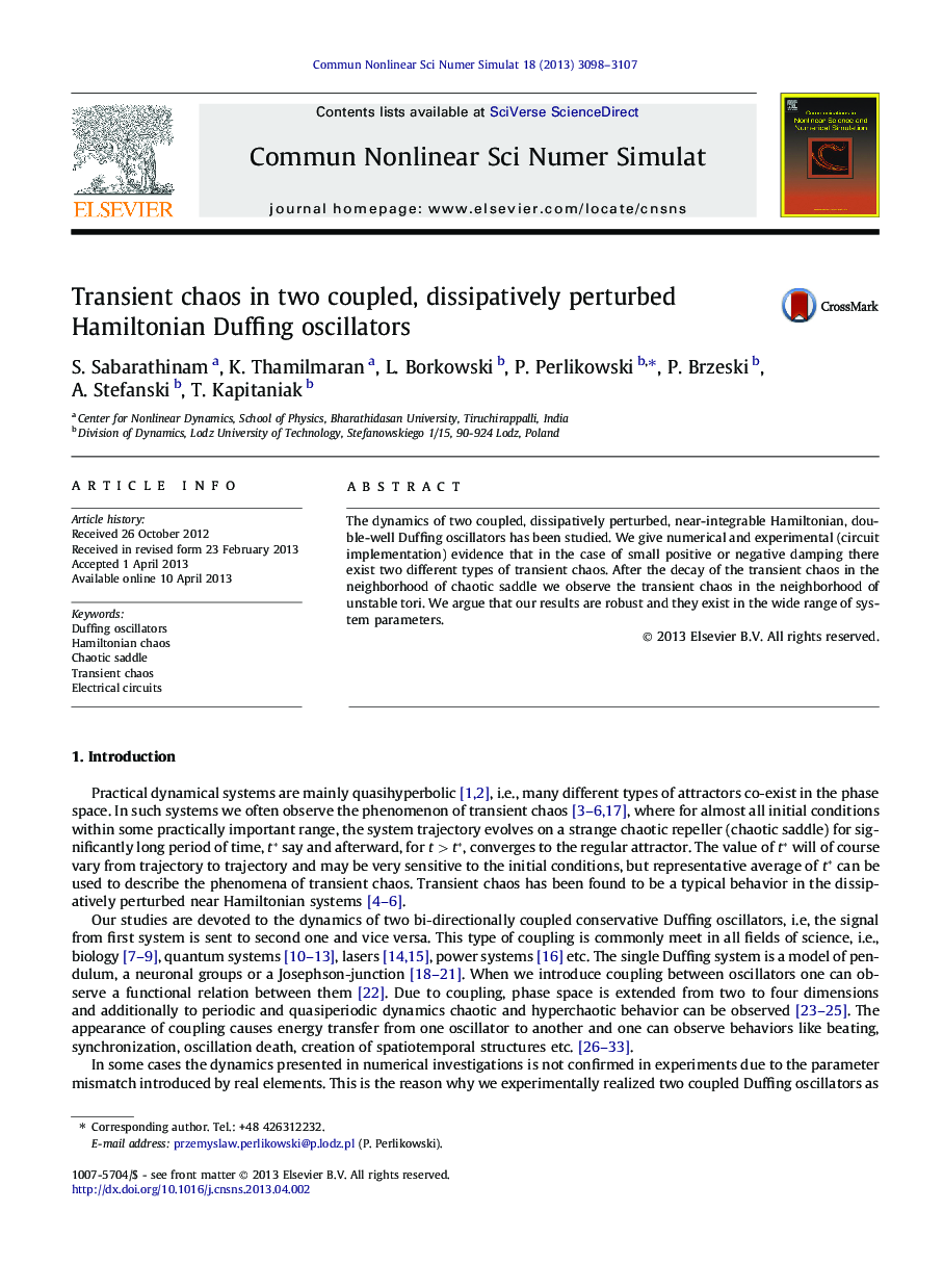 Transient chaos in two coupled, dissipatively perturbed Hamiltonian Duffing oscillators