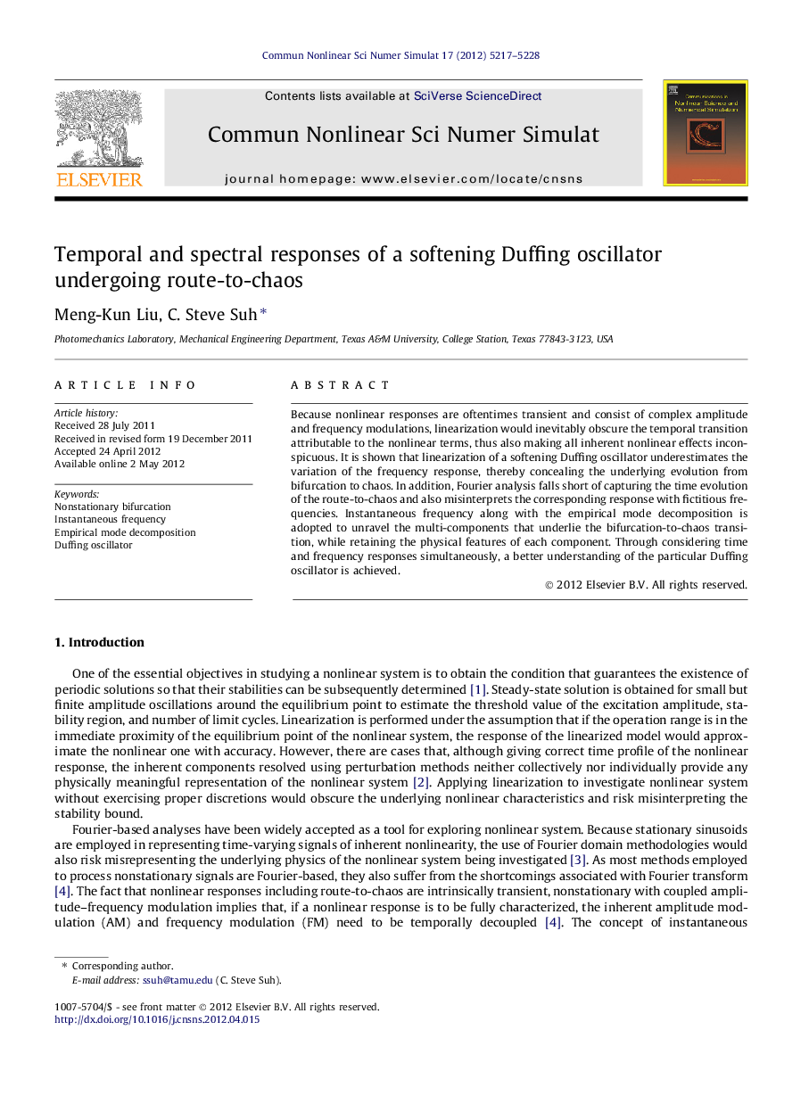 Temporal and spectral responses of a softening Duffing oscillator undergoing route-to-chaos