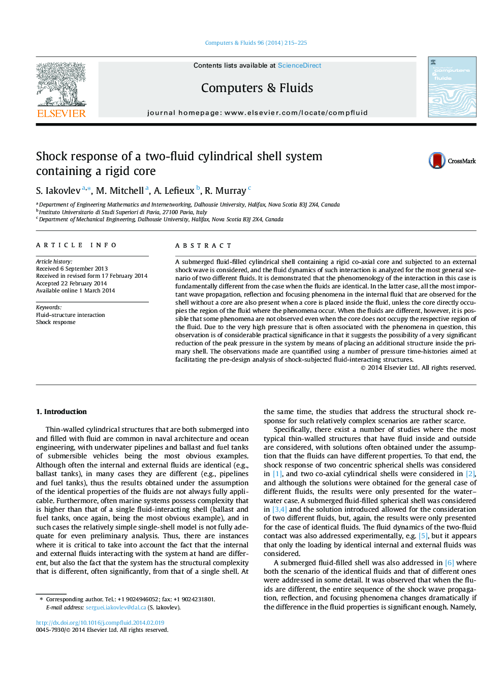 Shock response of a two-fluid cylindrical shell system containing a rigid core