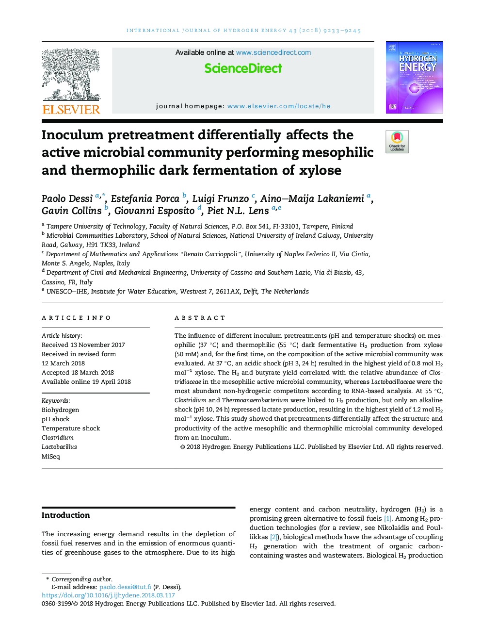 Inoculum pretreatment differentially affects the active microbial community performing mesophilic and thermophilic dark fermentation of xylose