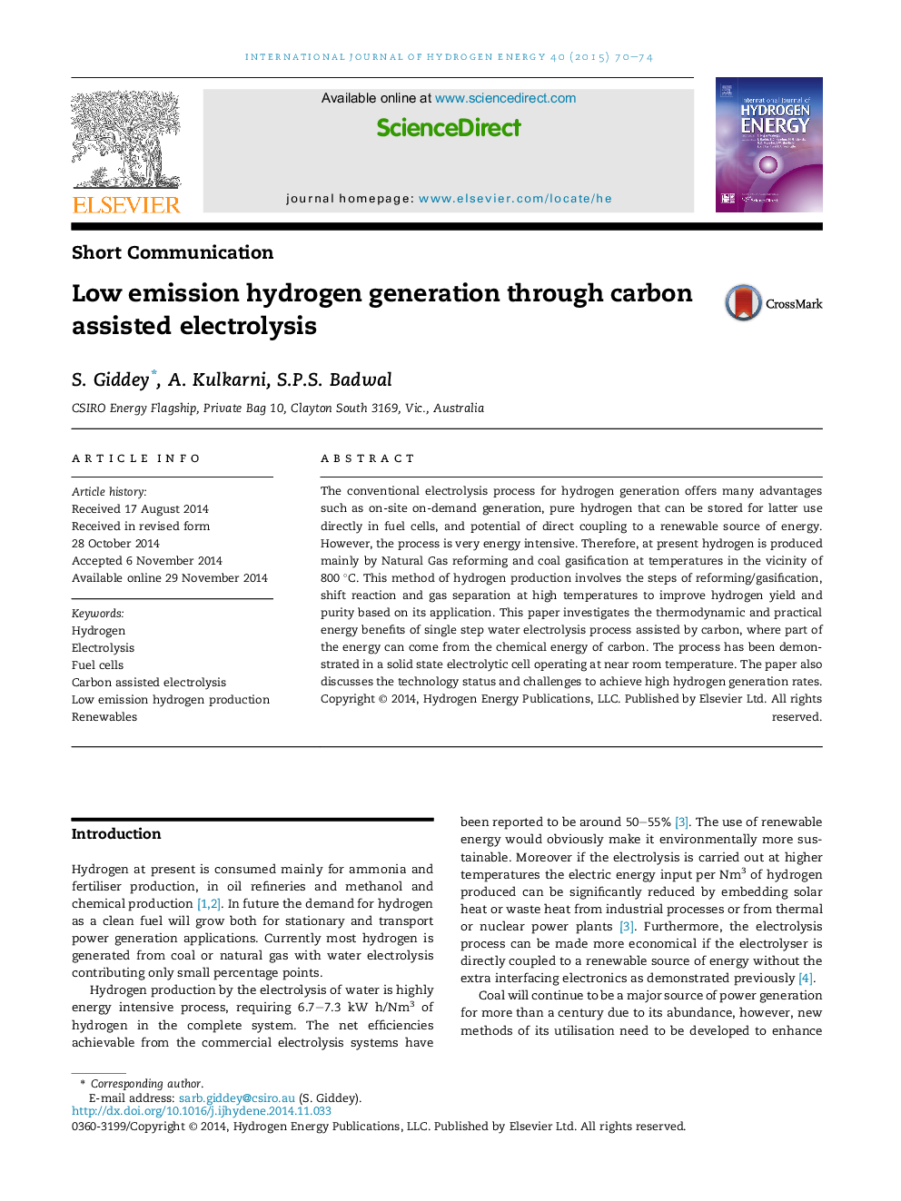 Low emission hydrogen generation through carbon assisted electrolysis