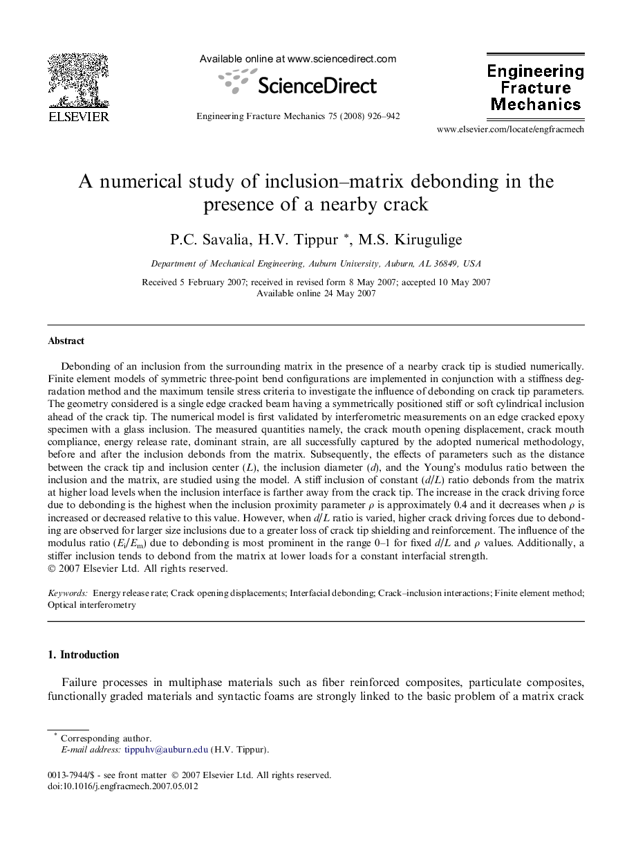 A numerical study of inclusion–matrix debonding in the presence of a nearby crack