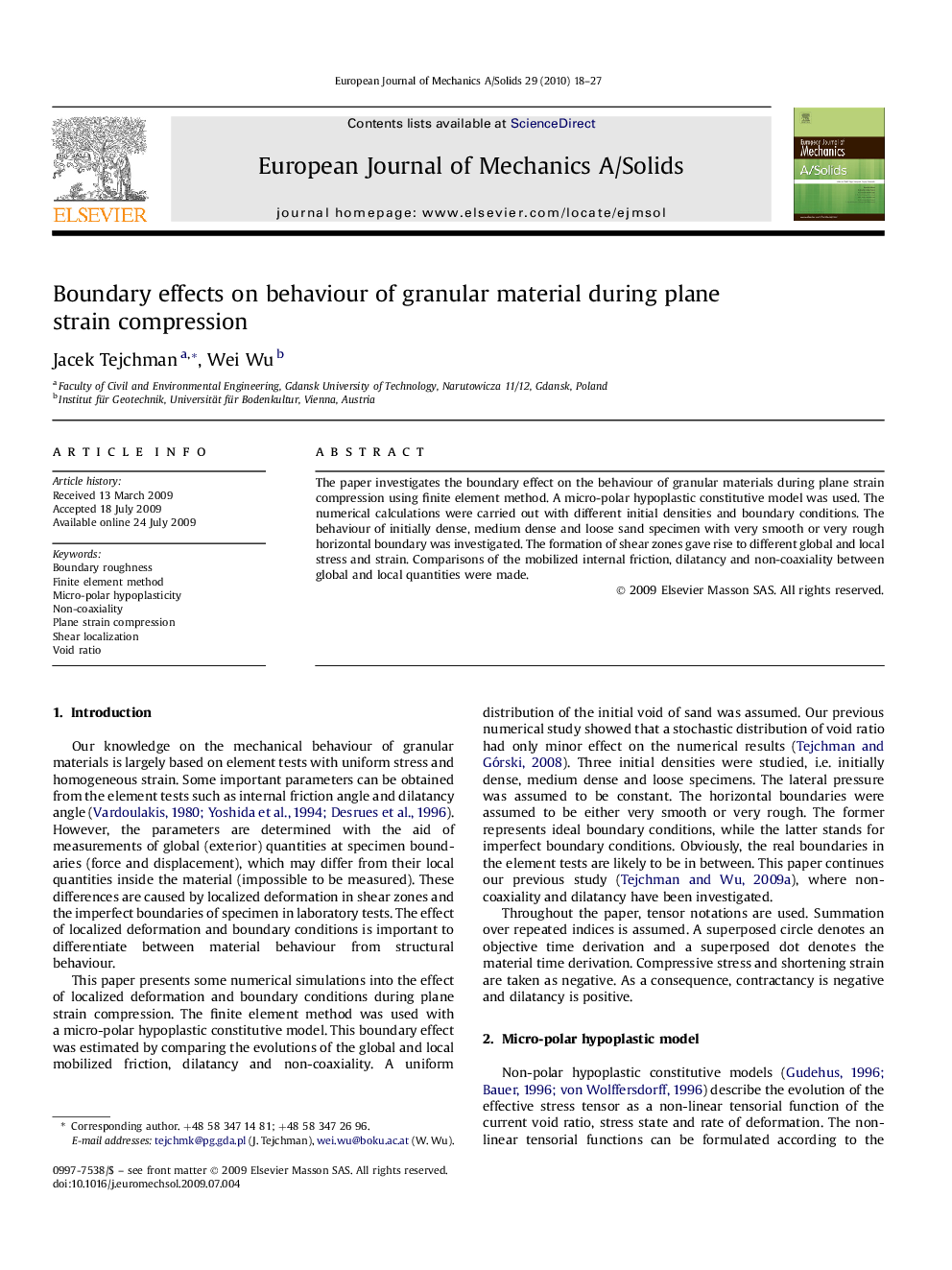 Boundary effects on behaviour of granular material during plane strain compression