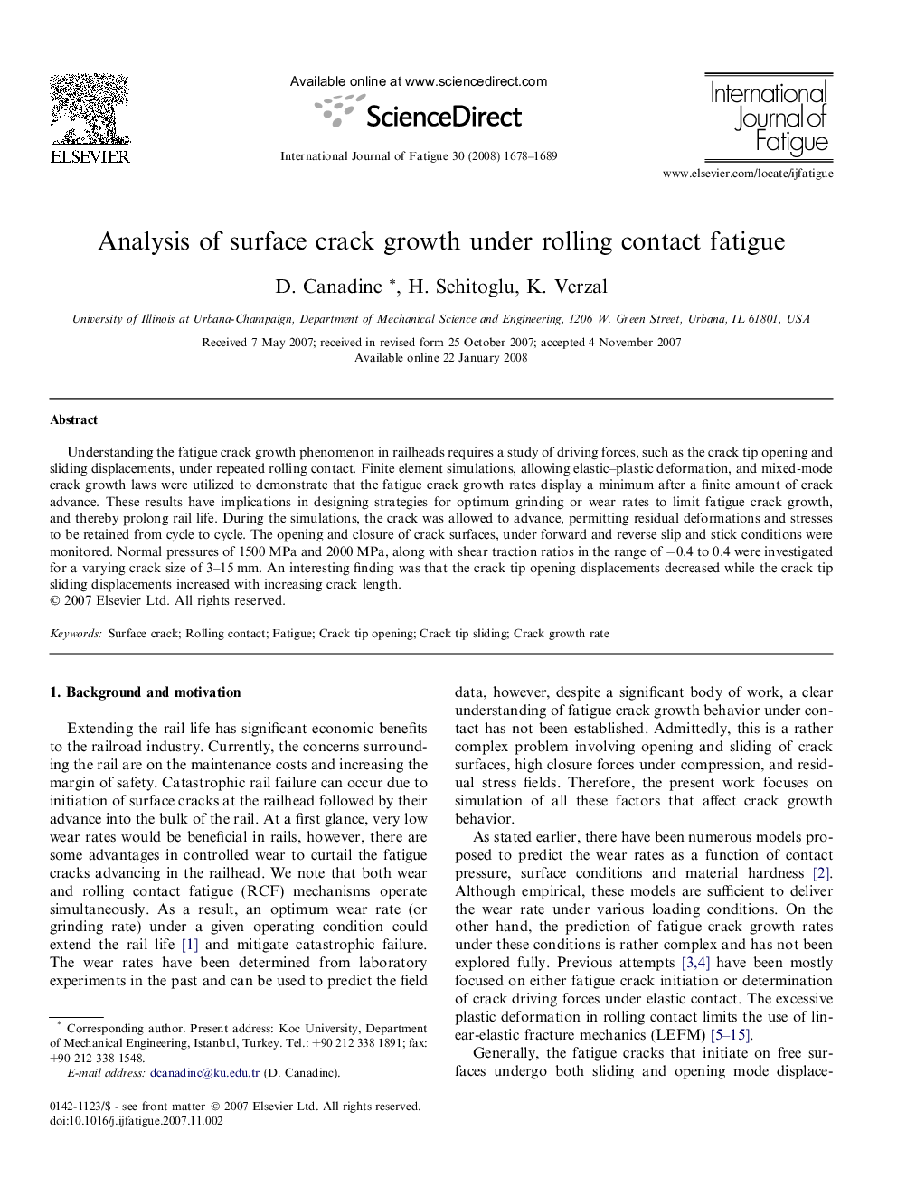 Analysis of surface crack growth under rolling contact fatigue