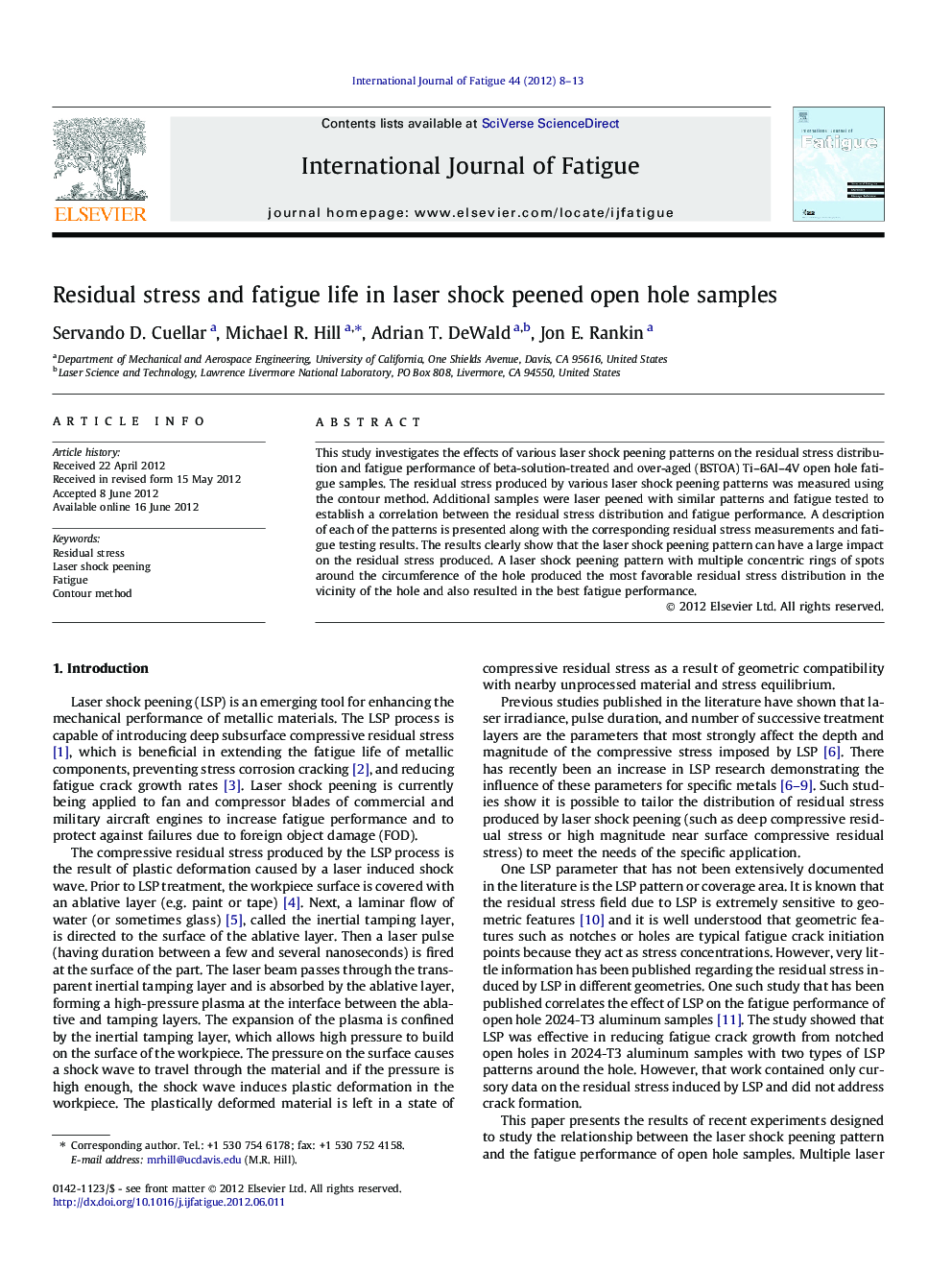 Residual stress and fatigue life in laser shock peened open hole samples