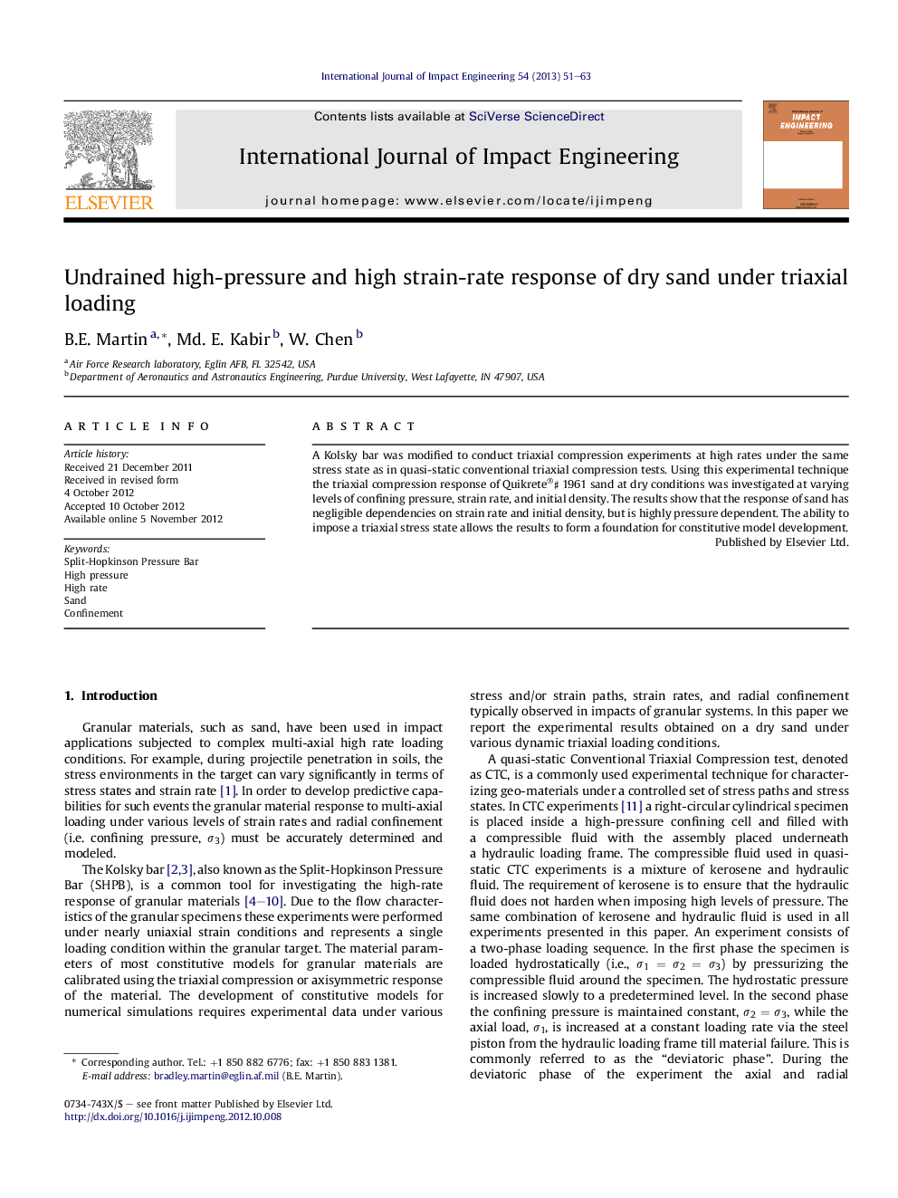 Undrained high-pressure and high strain-rate response of dry sand under triaxial loading