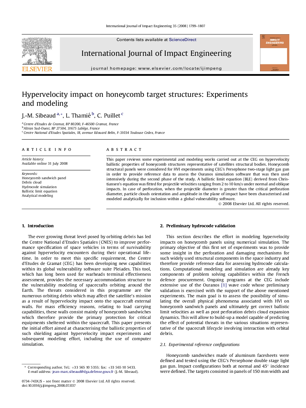 Hypervelocity impact on honeycomb target structures: Experiments and modeling