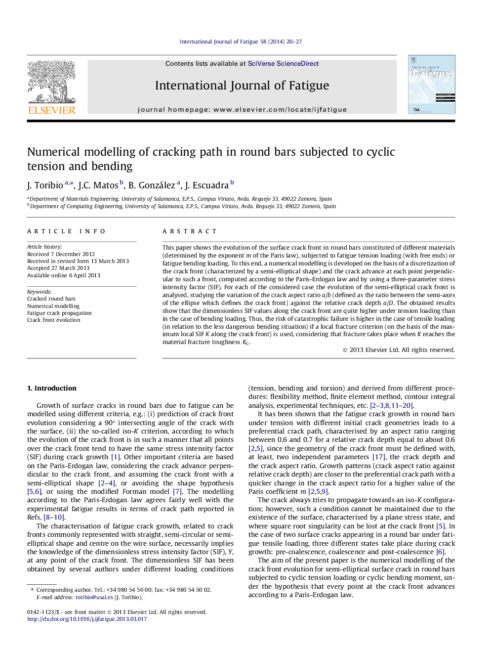 Numerical modelling of cracking path in round bars subjected to cyclic tension and bending