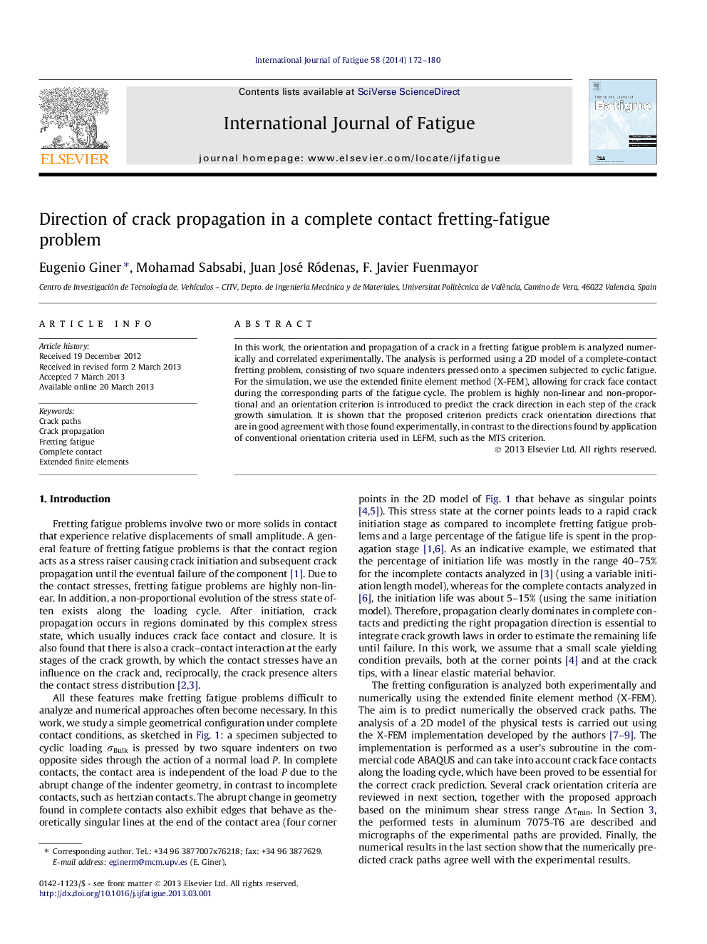 Direction of crack propagation in a complete contact fretting-fatigue problem