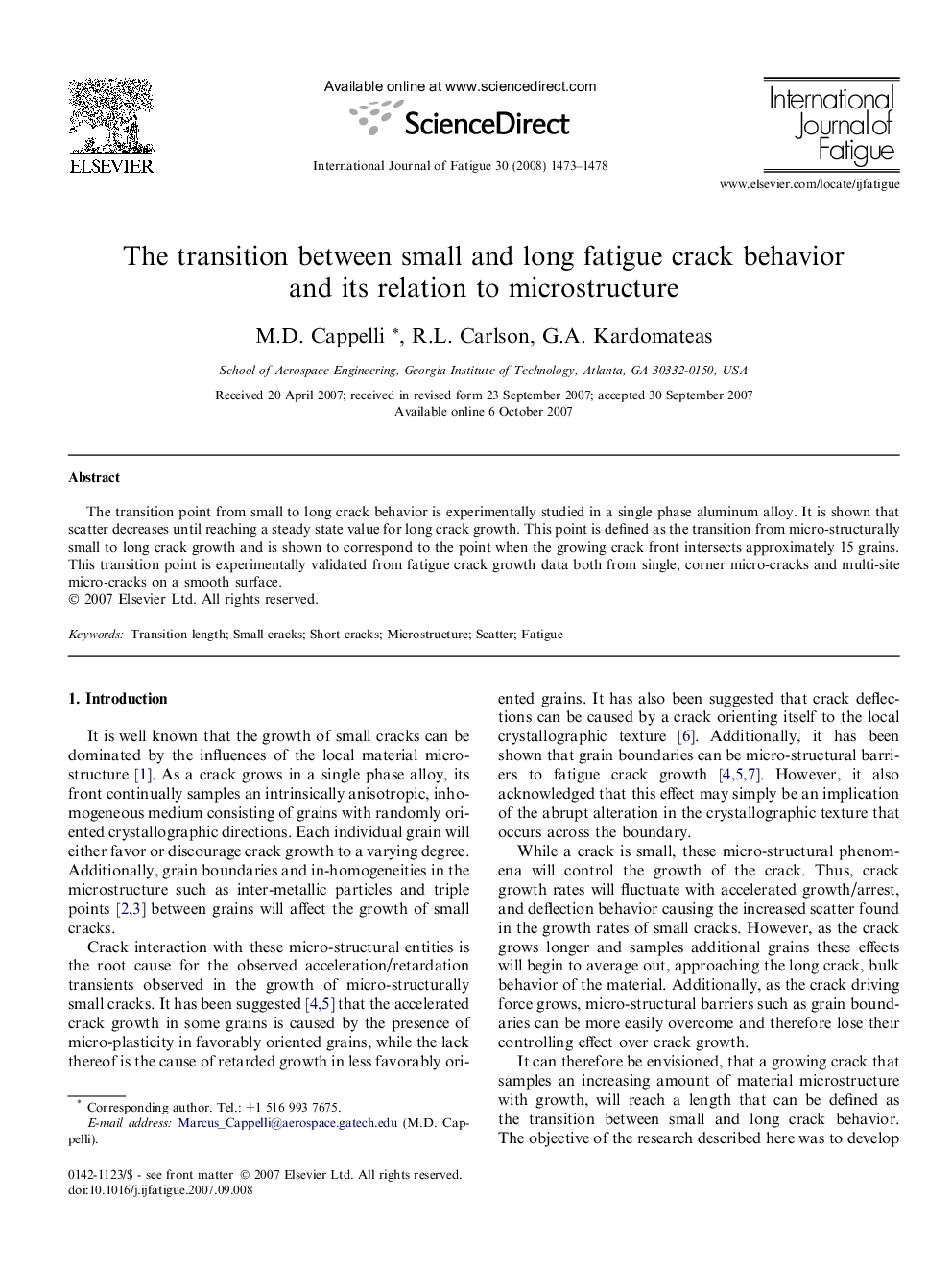 The transition between small and long fatigue crack behavior and its relation to microstructure