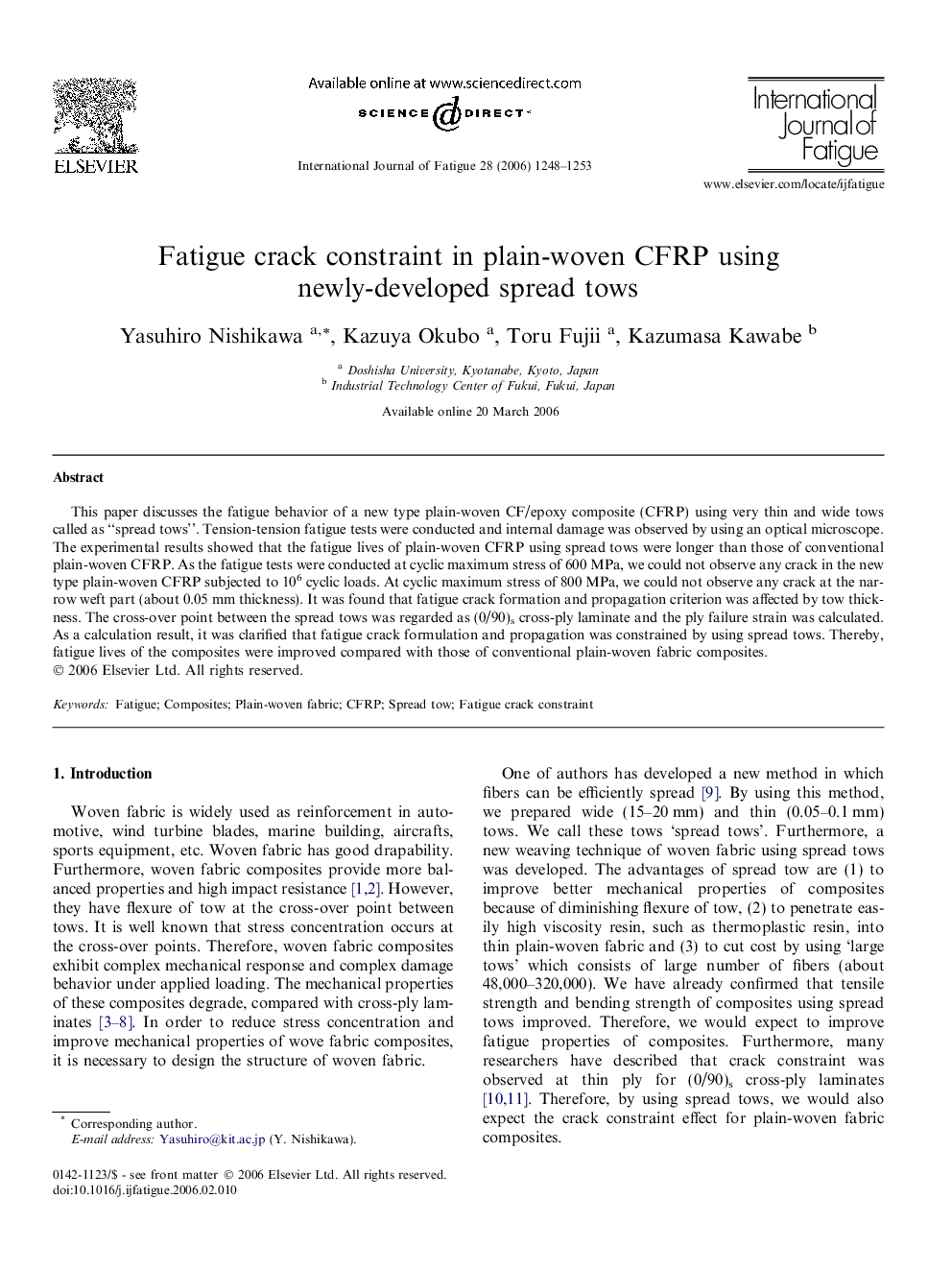 Fatigue crack constraint in plain-woven CFRP using newly-developed spread tows