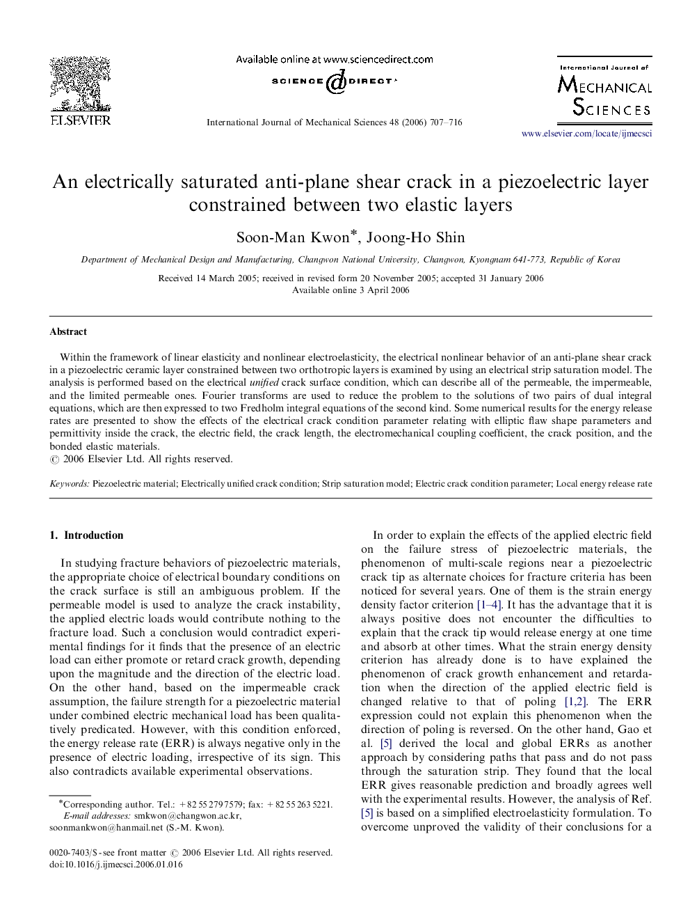 An electrically saturated anti-plane shear crack in a piezoelectric layer constrained between two elastic layers