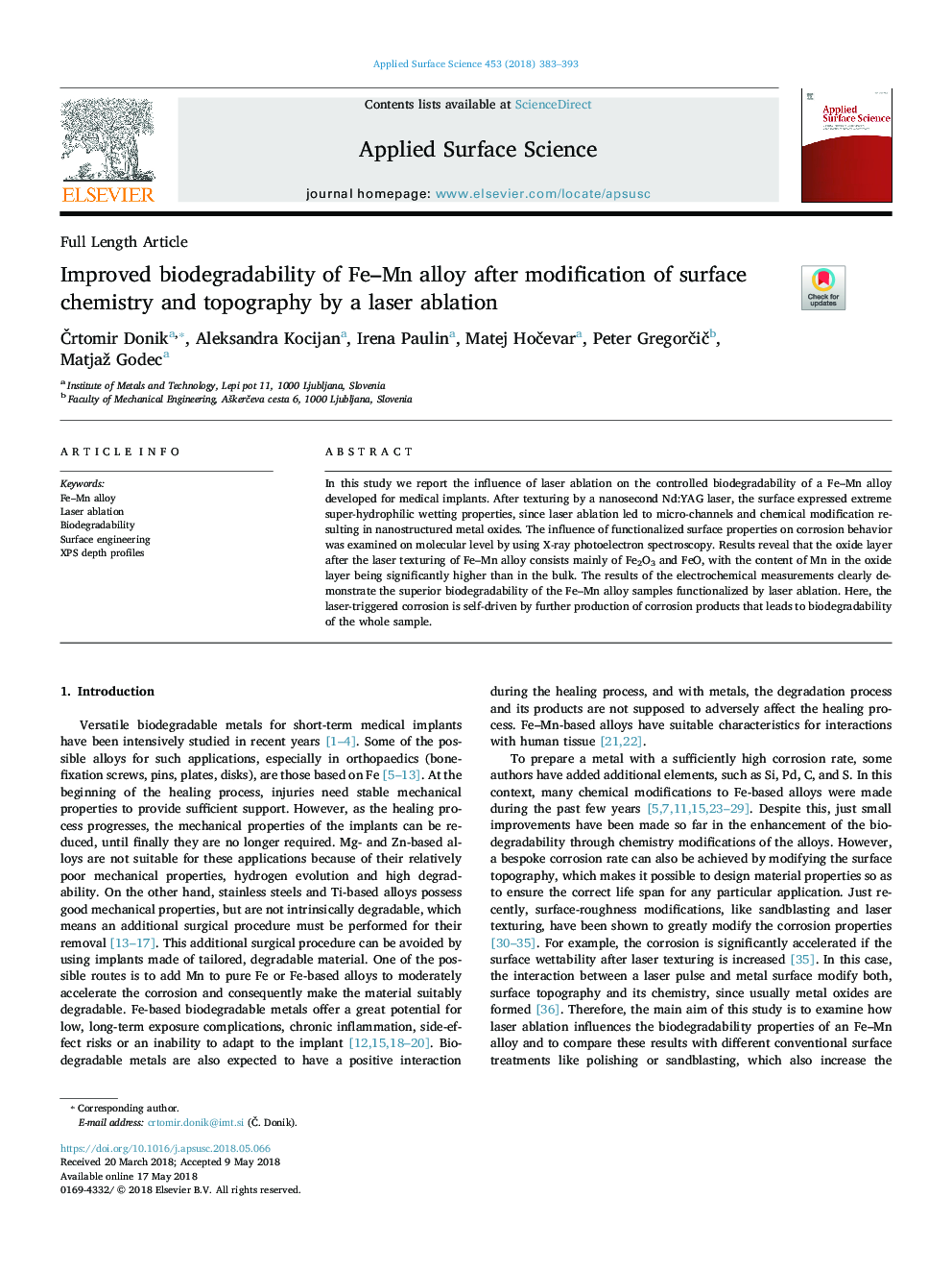 Improved biodegradability of Fe-Mn alloy after modification of surface chemistry and topography by a laser ablation