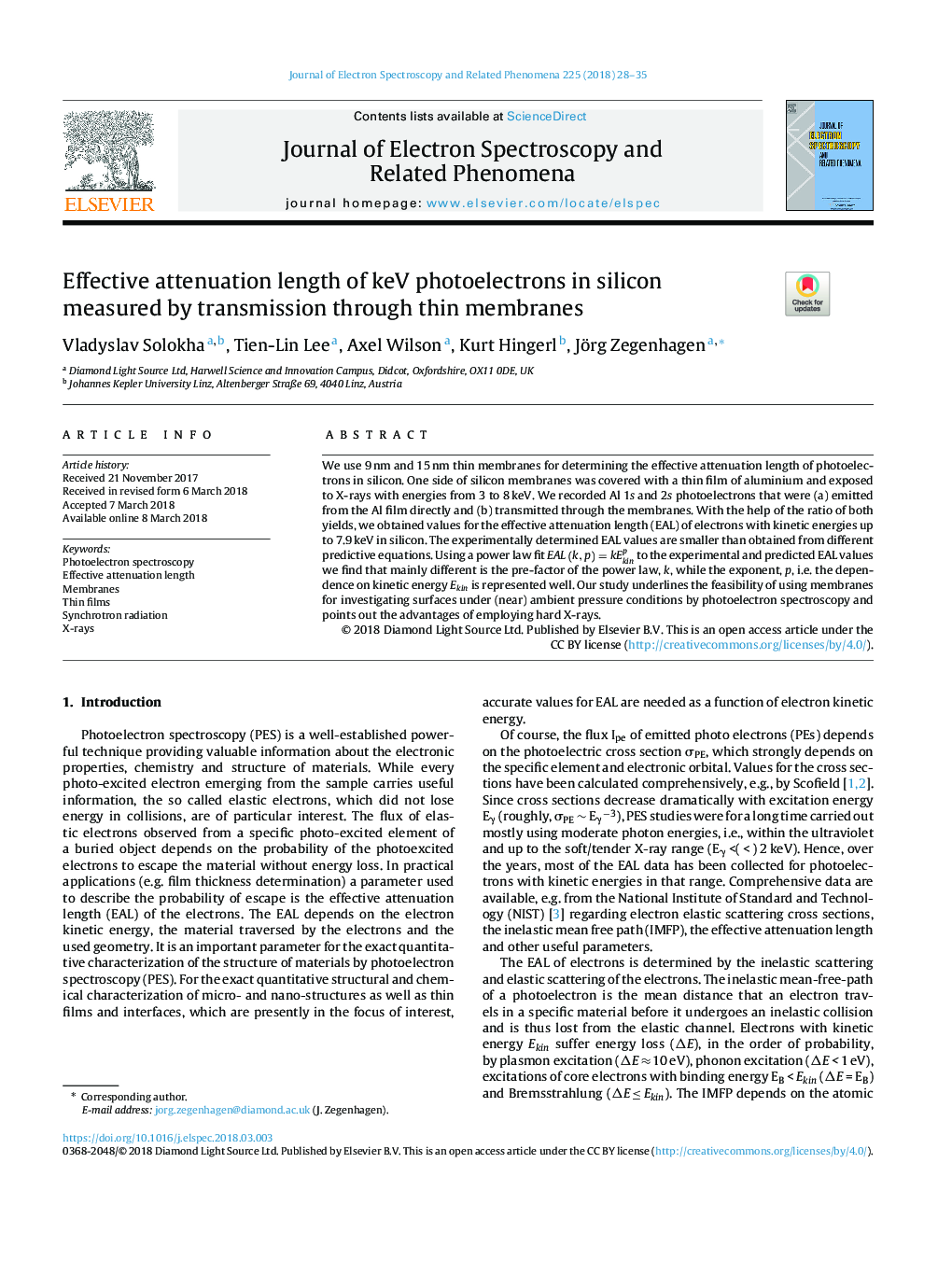 Effective attenuation length of keV photoelectrons in silicon measured by transmission through thin membranes