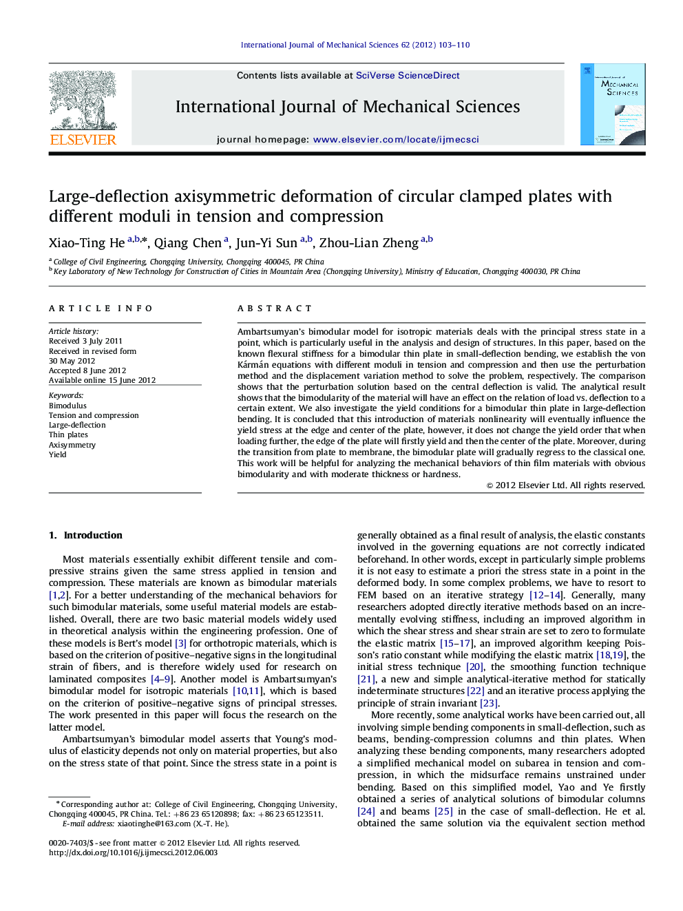 Large-deflection axisymmetric deformation of circular clamped plates with different moduli in tension and compression