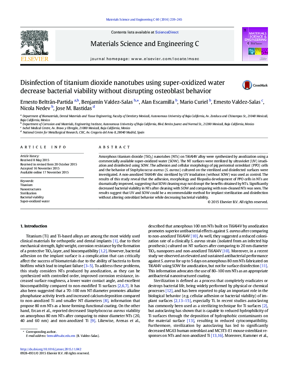 Disinfection of titanium dioxide nanotubes using super-oxidized water decrease bacterial viability without disrupting osteoblast behavior