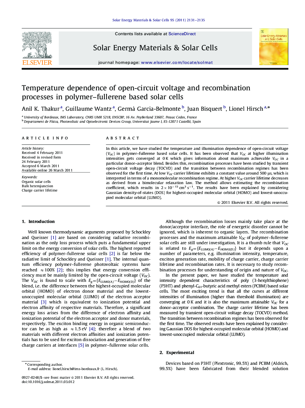 Temperature dependence of open-circuit voltage and recombination processes in polymer–fullerene based solar cells