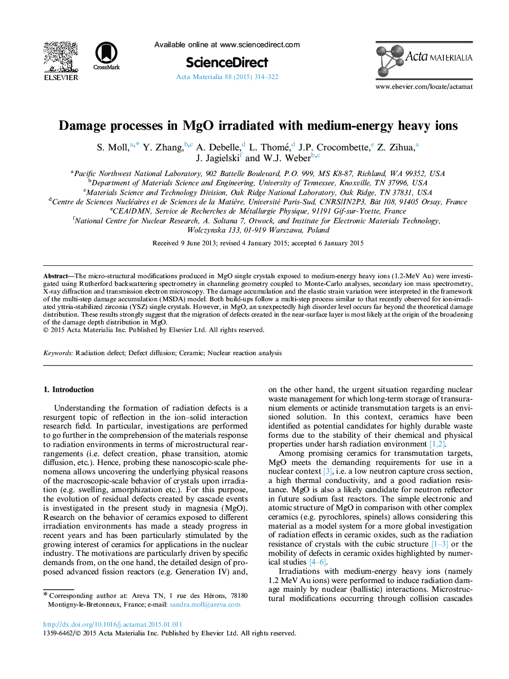 Damage processes in MgO irradiated with medium-energy heavy ions
