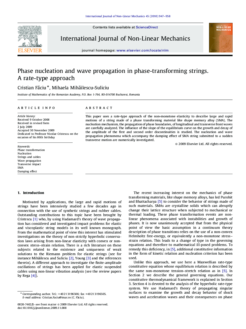 Phase nucleation and wave propagation in phase-transforming strings. A rate-type approach