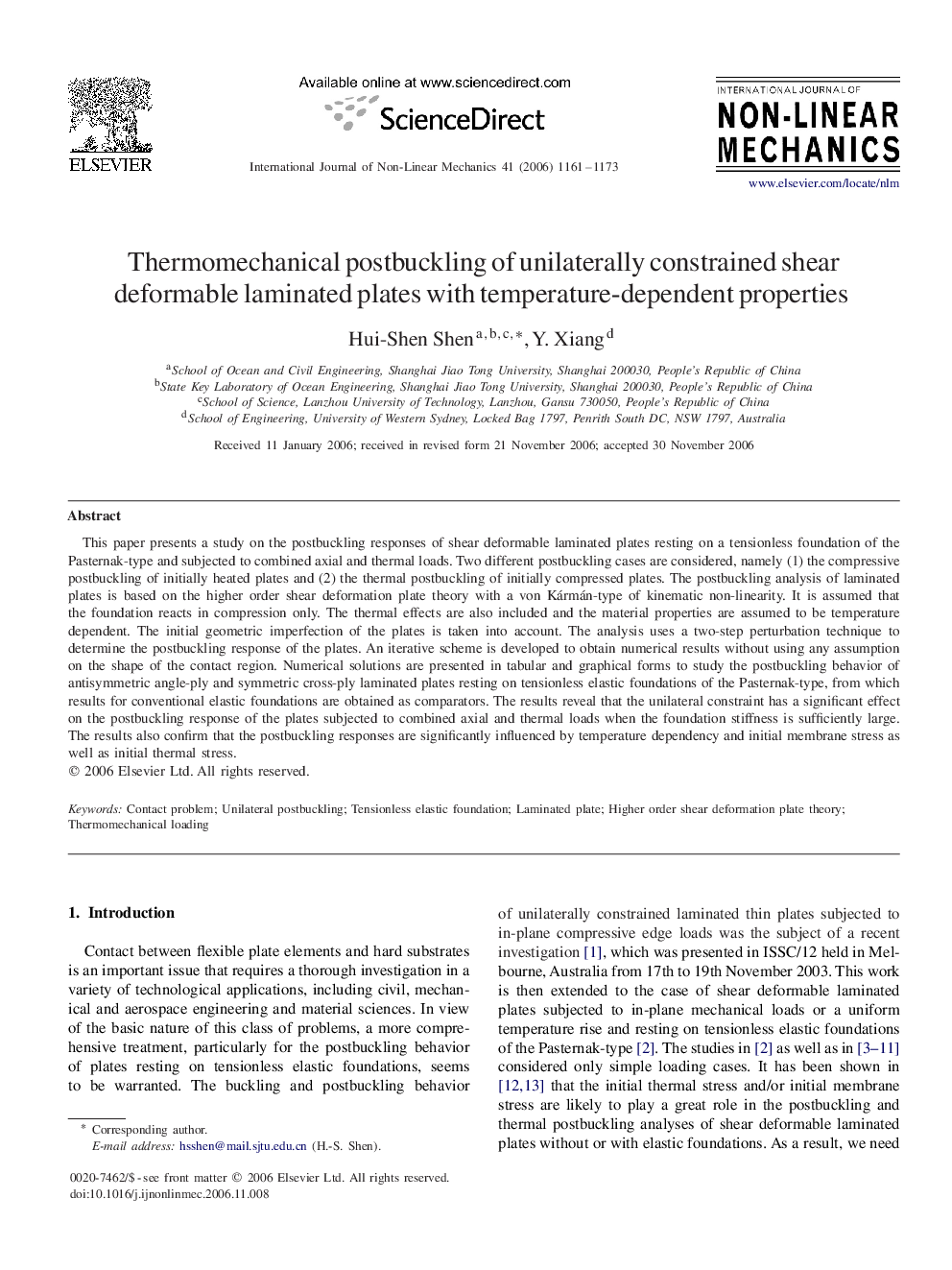 Thermomechanical postbuckling of unilaterally constrained shear deformable laminated plates with temperature-dependent properties