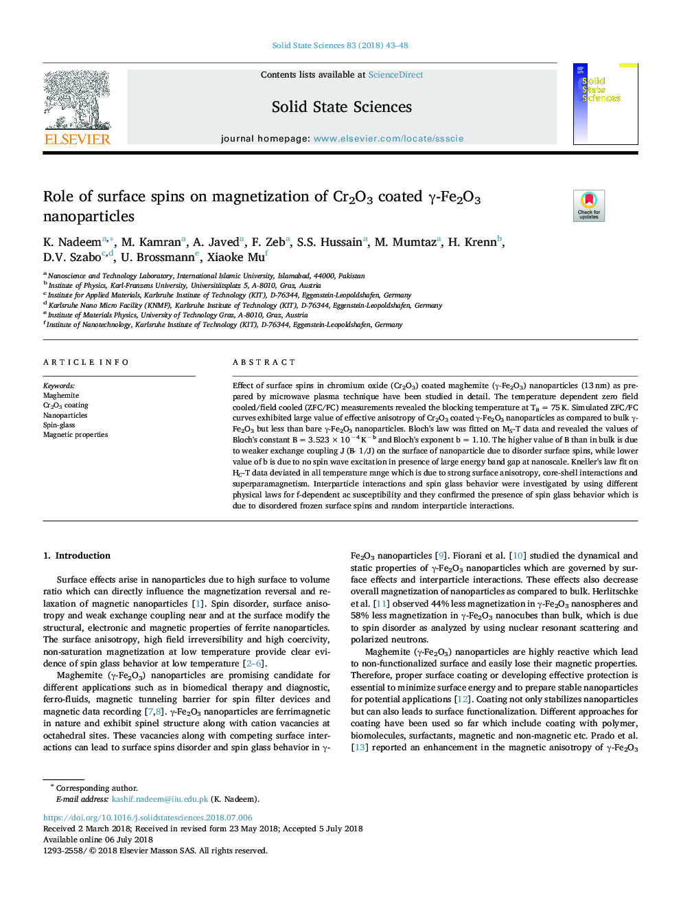 Role of surface spins on magnetization of Cr2O3 coated Î³-Fe2O3 nanoparticles