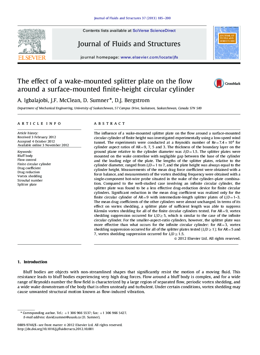 The effect of a wake-mounted splitter plate on the flow around a surface-mounted finite-height circular cylinder