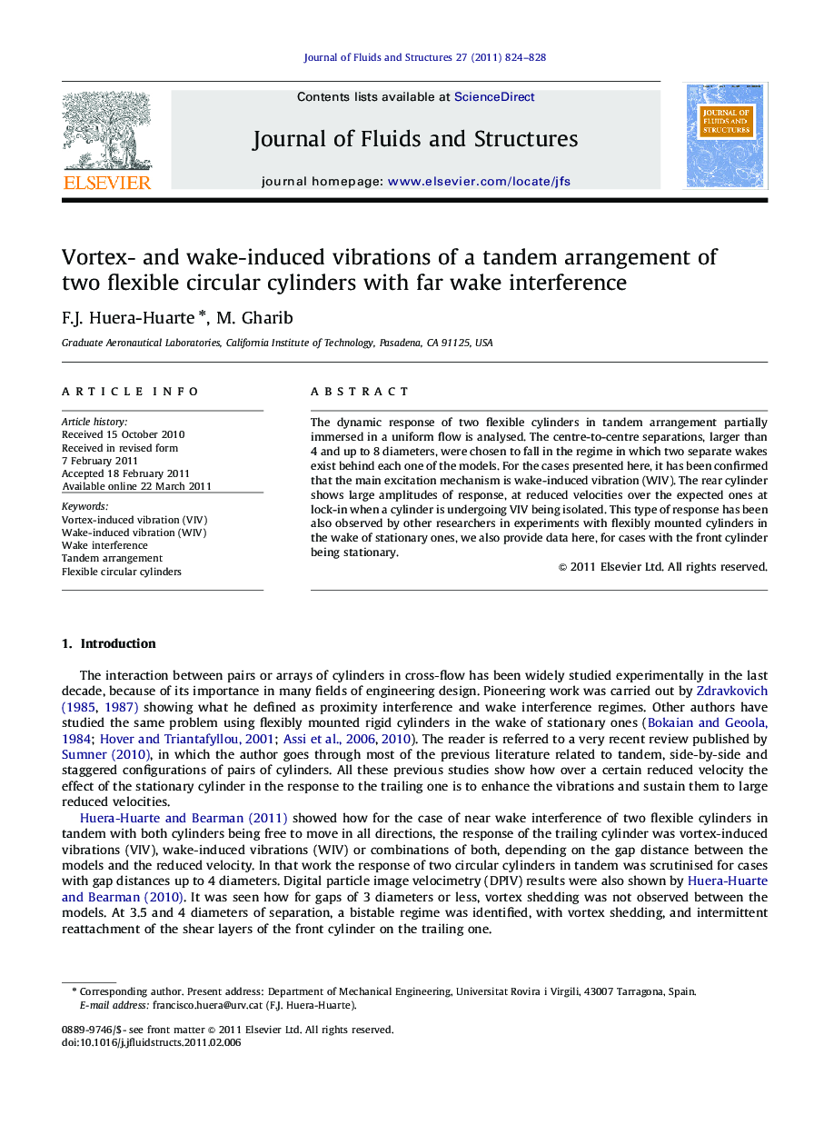 Vortex- and wake-induced vibrations of a tandem arrangement of two flexible circular cylinders with far wake interference