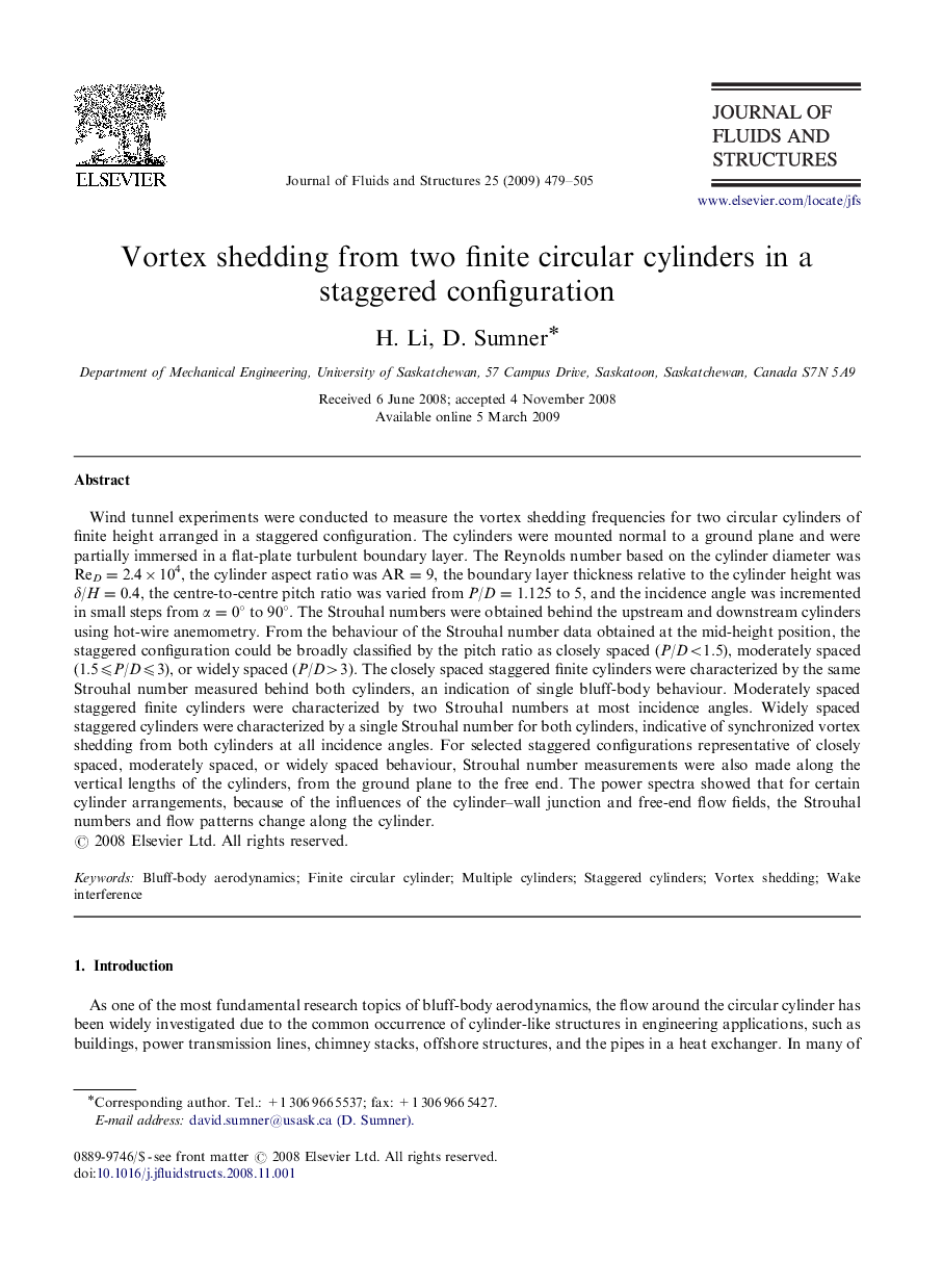 Vortex shedding from two finite circular cylinders in a staggered configuration