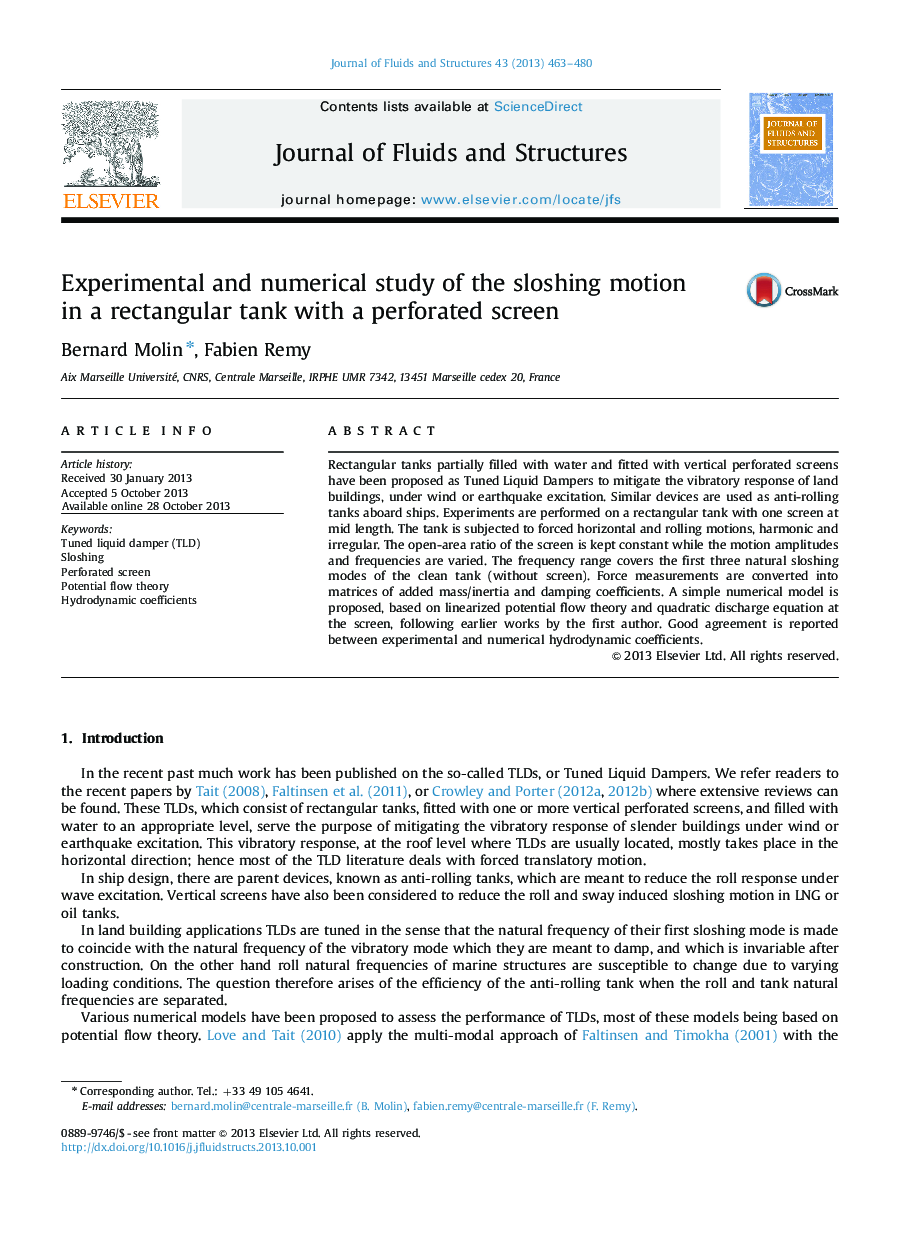 Experimental and numerical study of the sloshing motion in a rectangular tank with a perforated screen