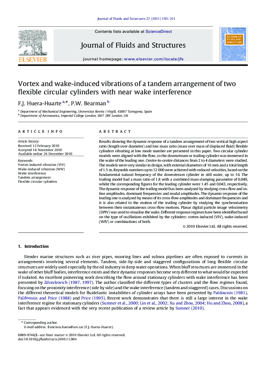 Vortex and wake-induced vibrations of a tandem arrangement of two flexible circular cylinders with near wake interference