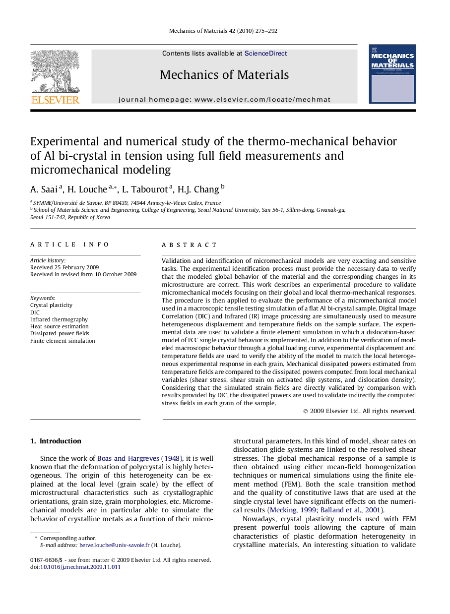 Experimental and numerical study of the thermo-mechanical behavior of Al bi-crystal in tension using full field measurements and micromechanical modeling