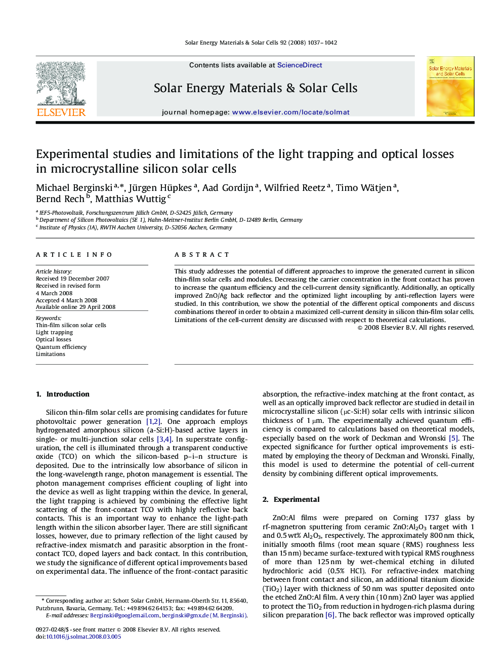 Experimental studies and limitations of the light trapping and optical losses in microcrystalline silicon solar cells