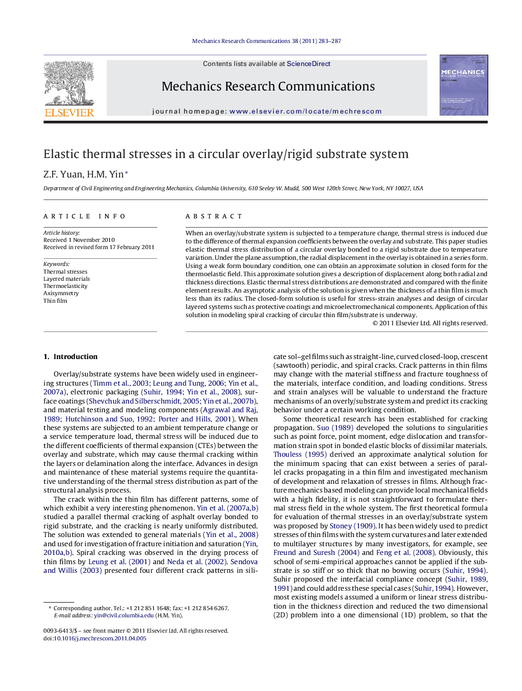 Elastic thermal stresses in a circular overlay/rigid substrate system