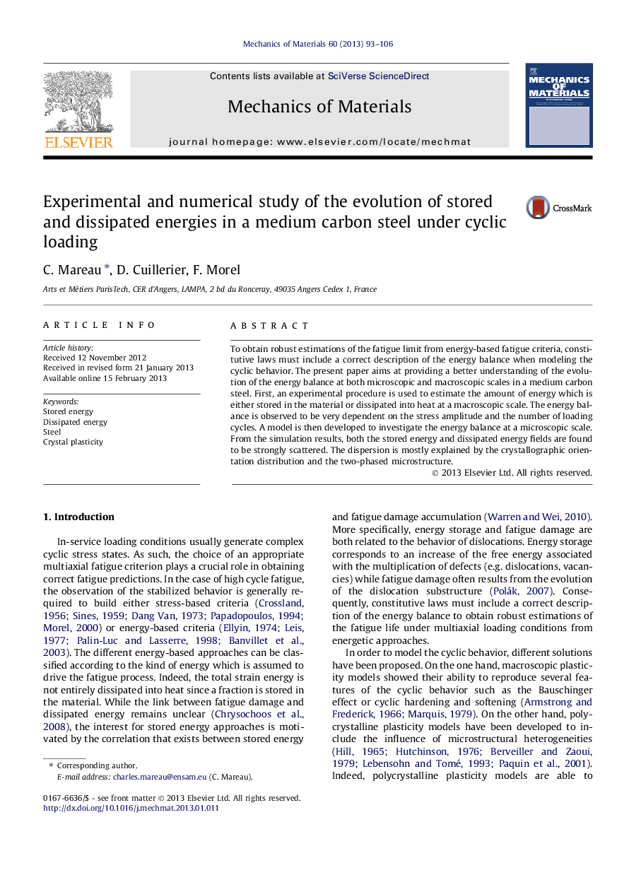 Experimental and numerical study of the evolution of stored and dissipated energies in a medium carbon steel under cyclic loading