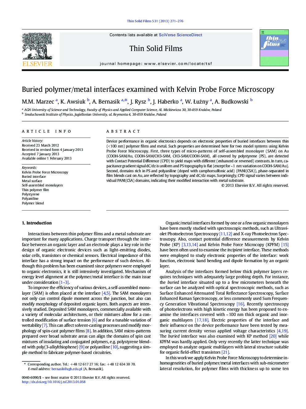 Buried polymer/metal interfaces examined with Kelvin Probe Force Microscopy