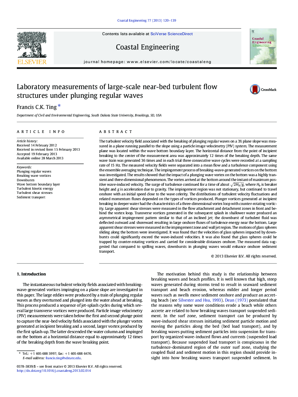 Laboratory measurements of large-scale near-bed turbulent flow structures under plunging regular waves